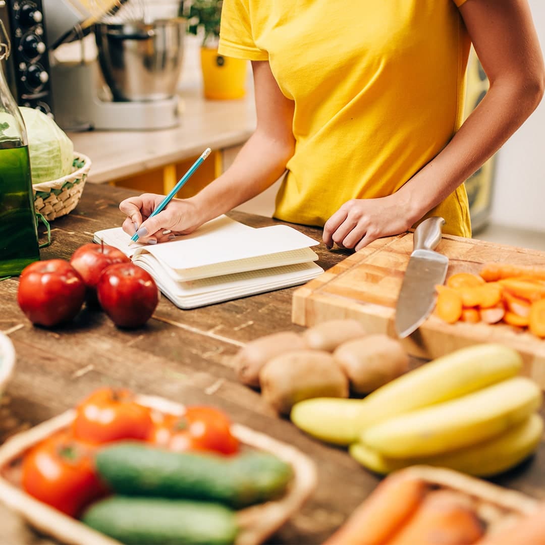 Woman learning about her nutrition in the kitchen