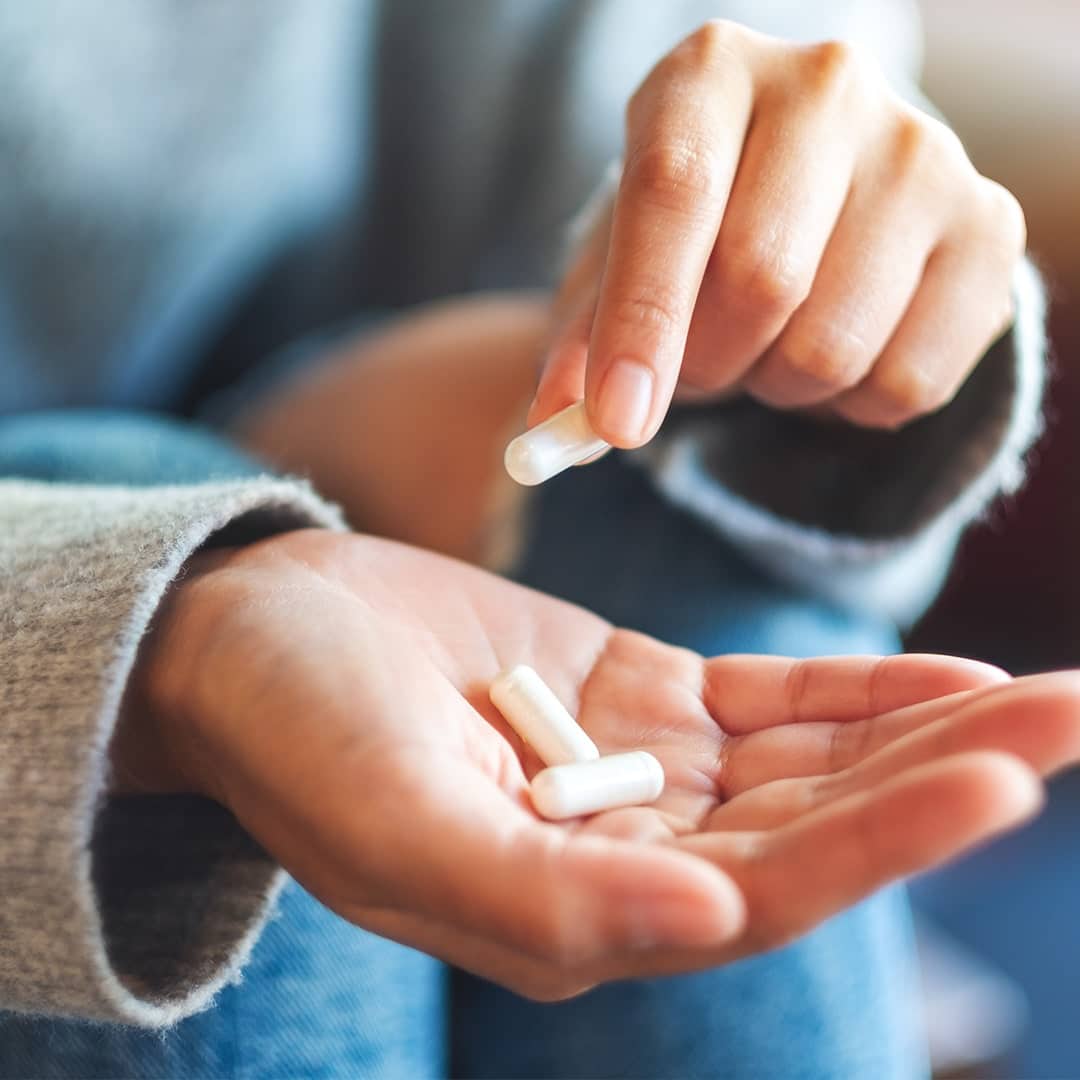 Woman taking medicine