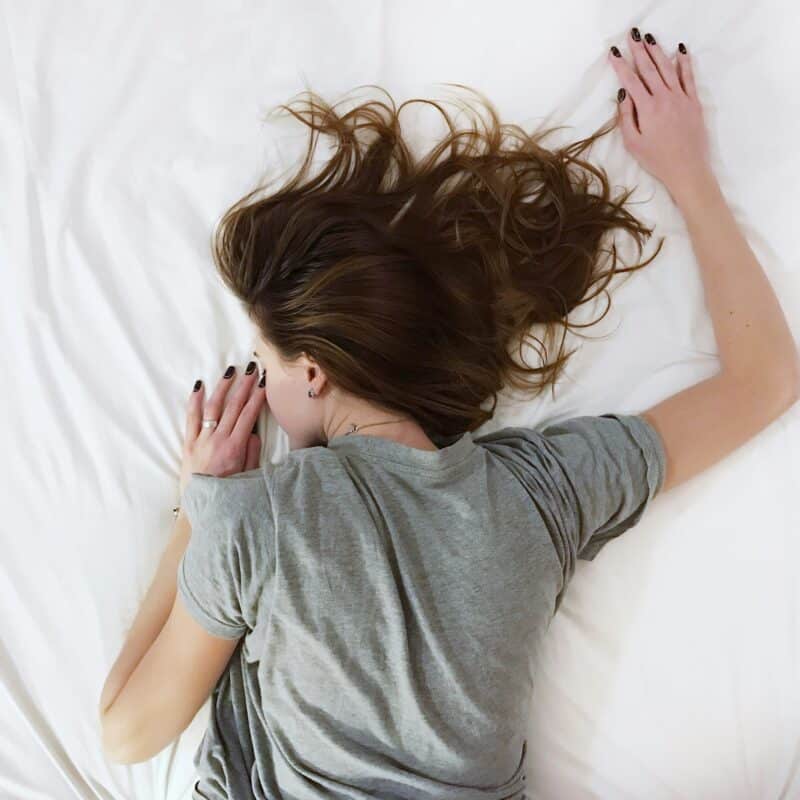 a woman resting in bed