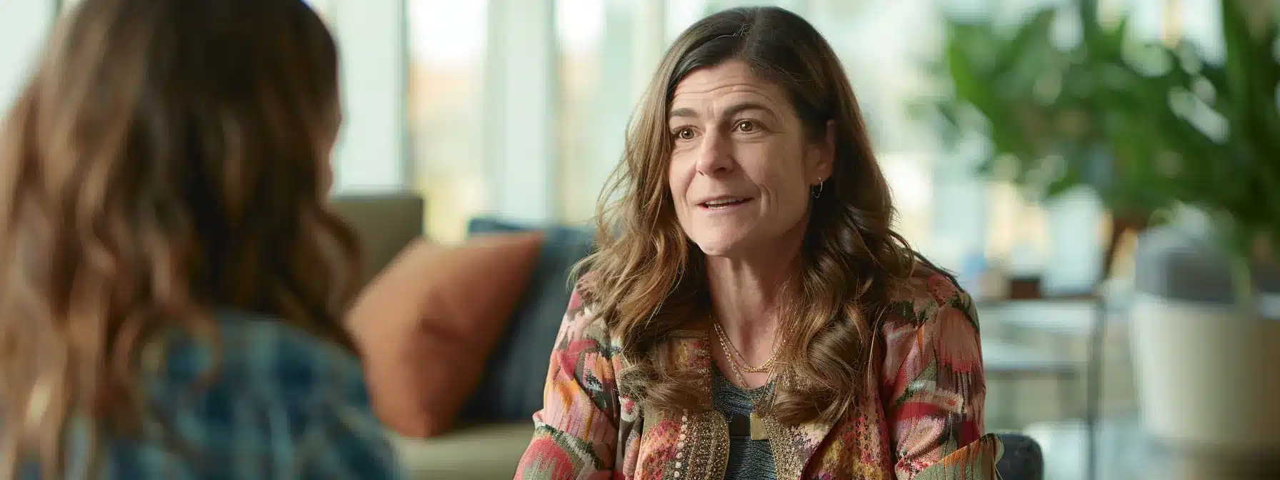 a woman with endometriosis confidently discussing career advancement with her employer, surrounded by supportive colleagues in a modern office setting. a woman with endometriosis confidently discussing career advancement with her employer, surrounded by supportive colleagues in a modern office setting.