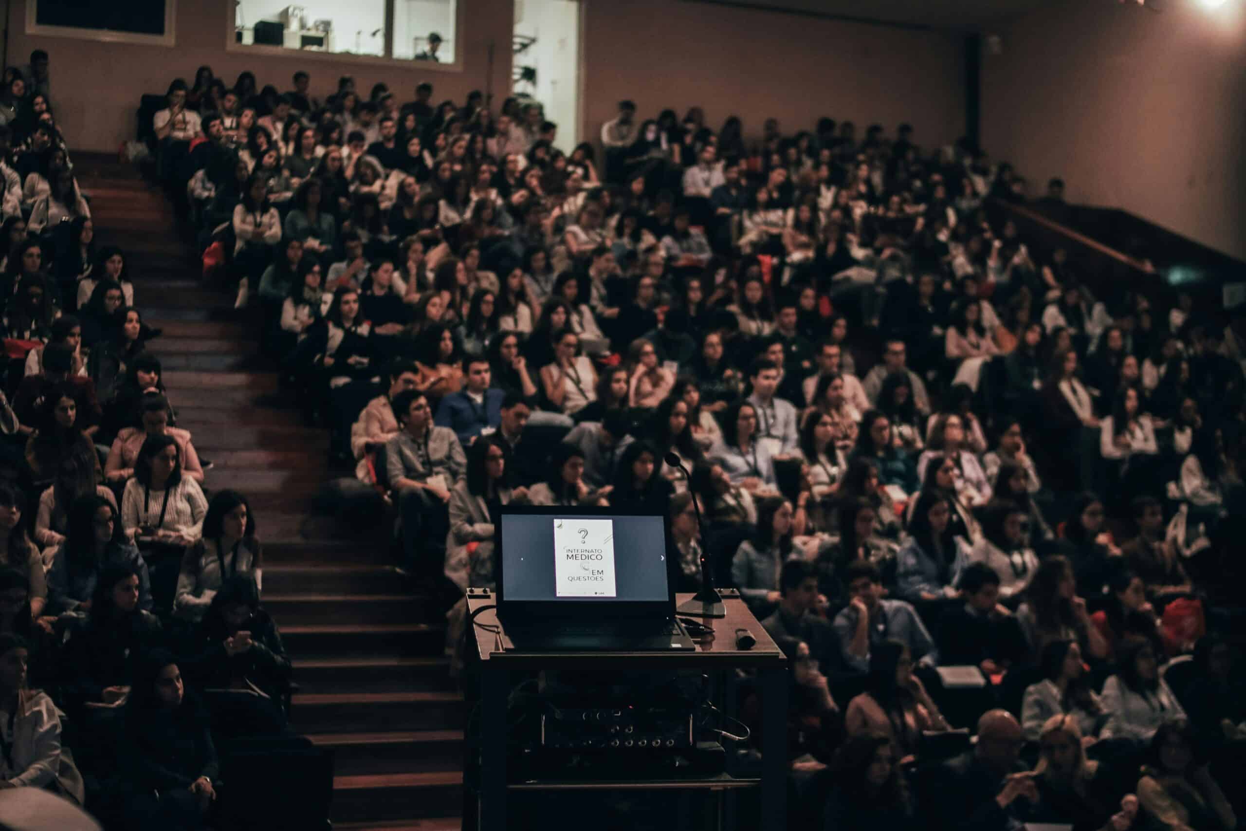 A huge crowd sitting in audience