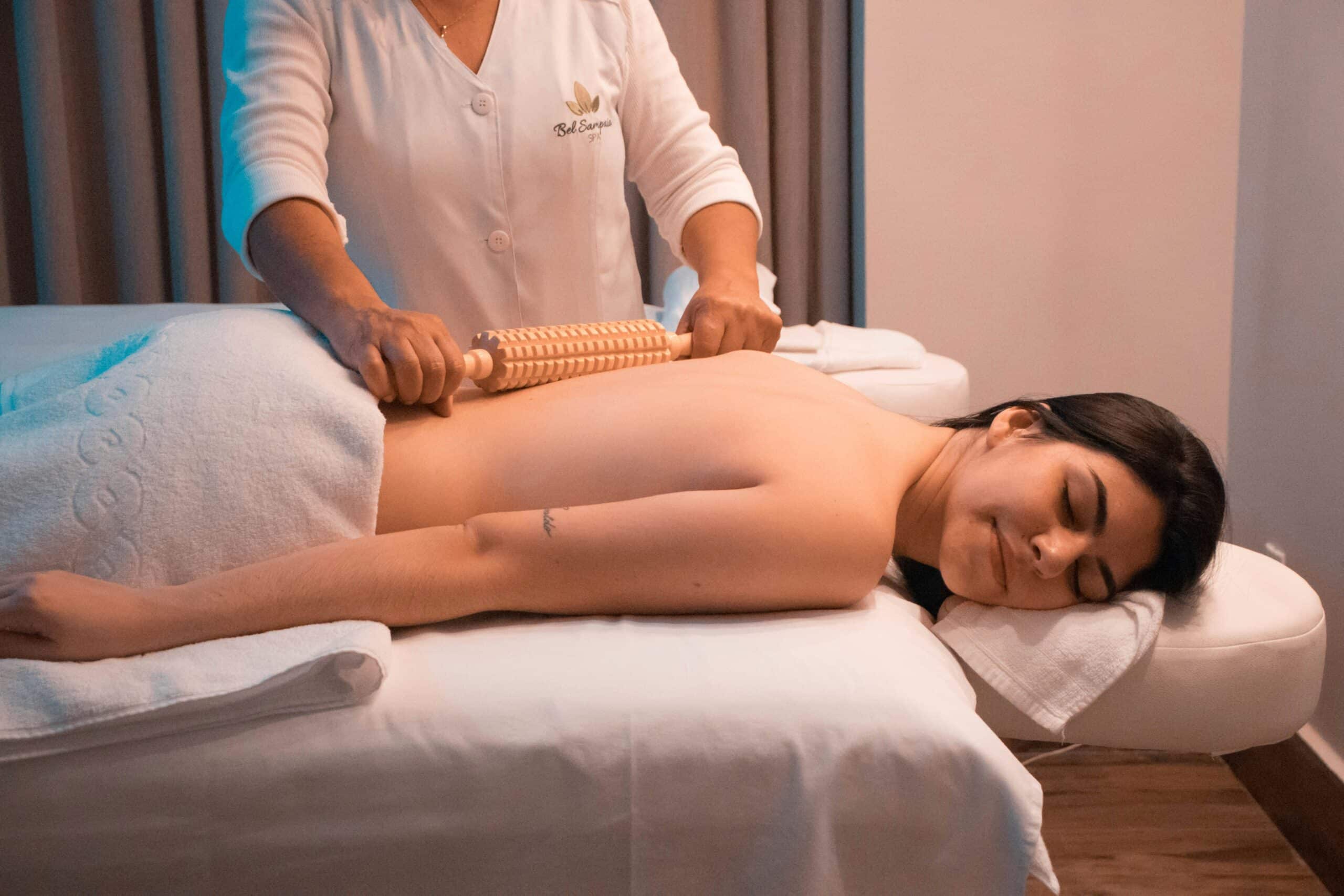 Woman receiving manual therapy treatment for endometriosis relief