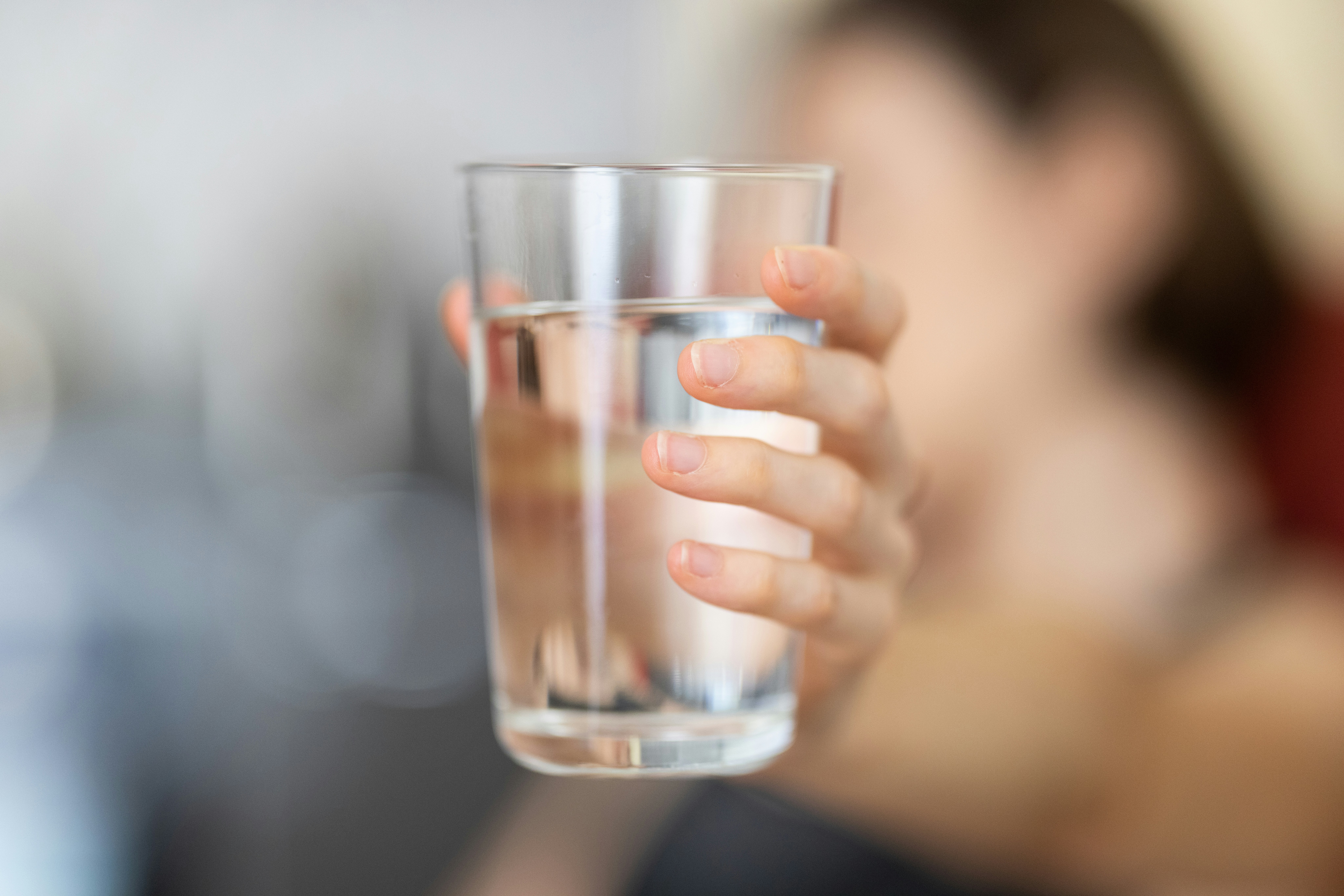 a woman holding a glass of water - Rachael Haverland Site a woman holding a glass of water