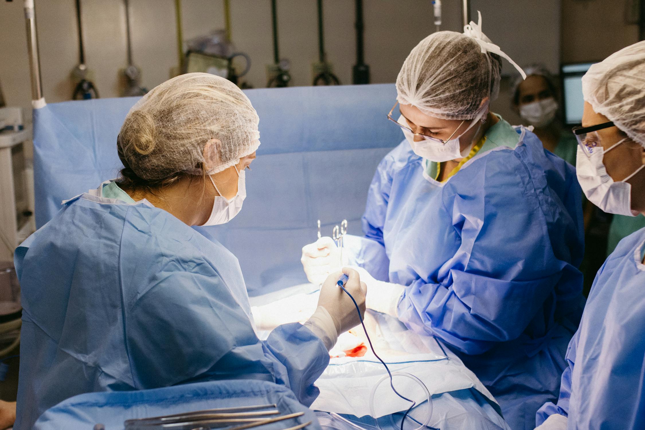 free photo of team of surgeons performing operation in operating roomjpeg - Rachael Haverland Site doctors doing a surgery