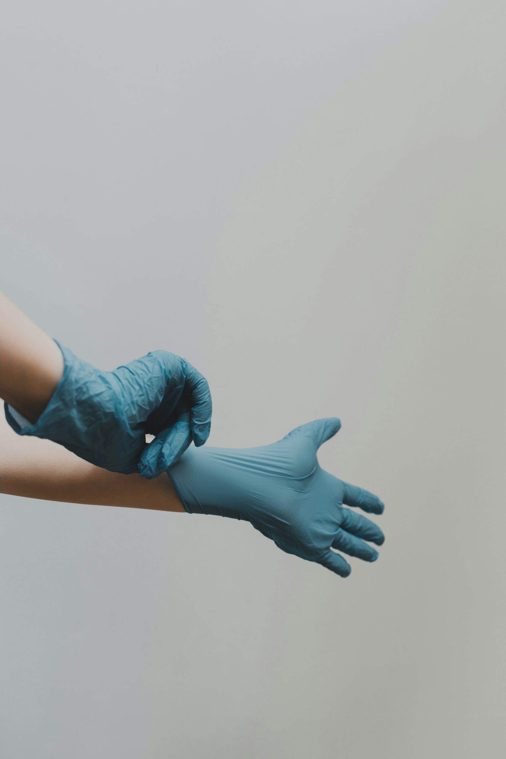 a person putting gloves on