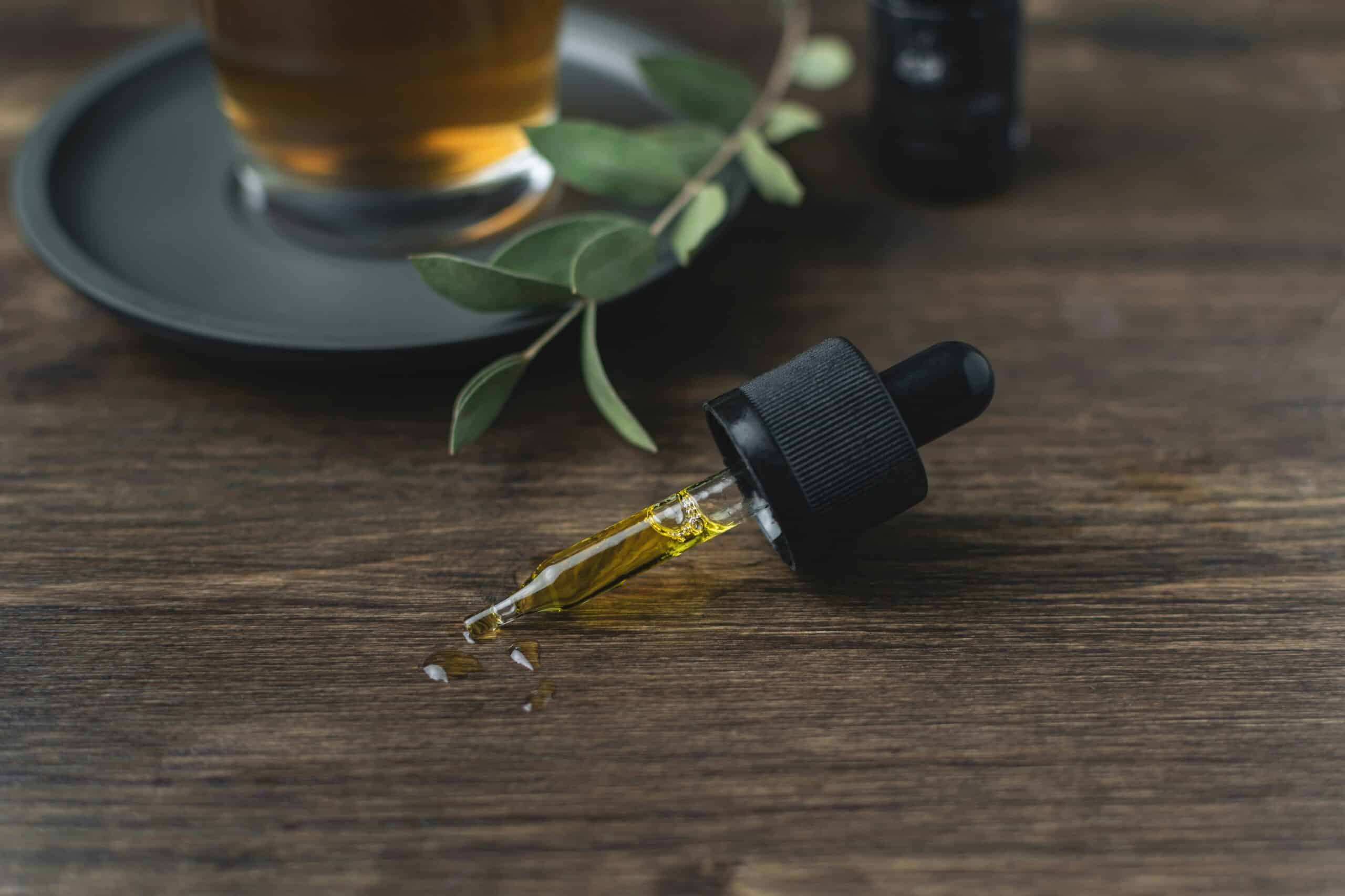 a cbd oil dropper on a table - Rachael Haverland Site a cbd oil dropper on a table