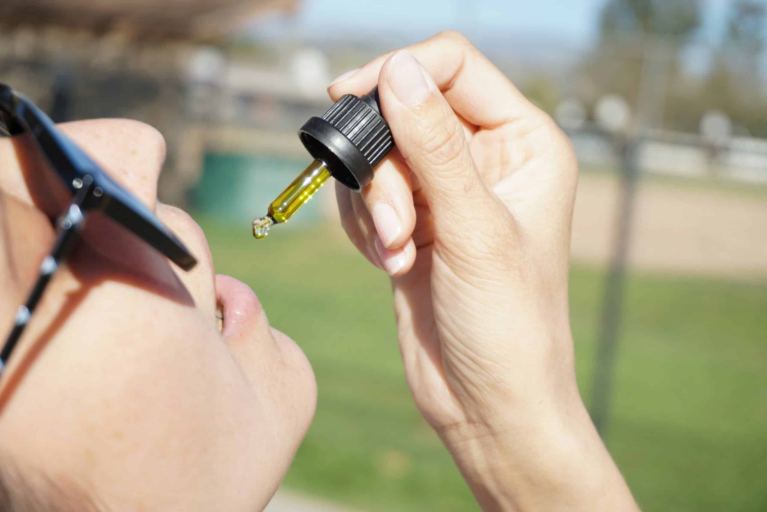 a woman drinking CBD oil - Rachael Haverland Site a woman drinking CBD oil