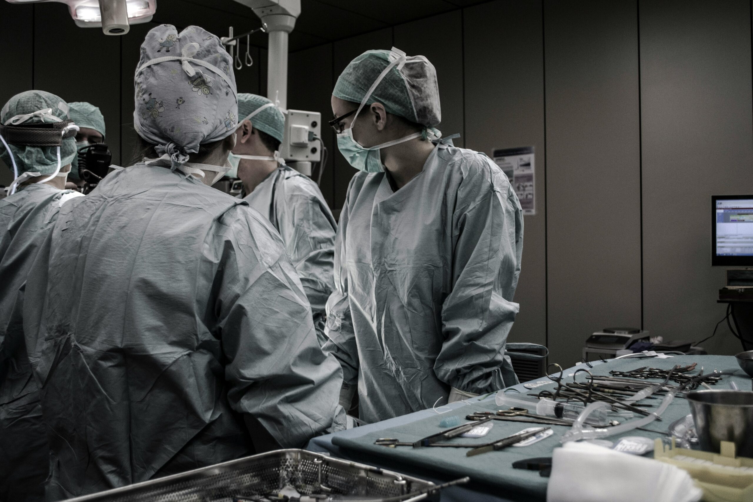 Medical team in an operating room performing surgery, representing surgical interventions for managing endometriosis.