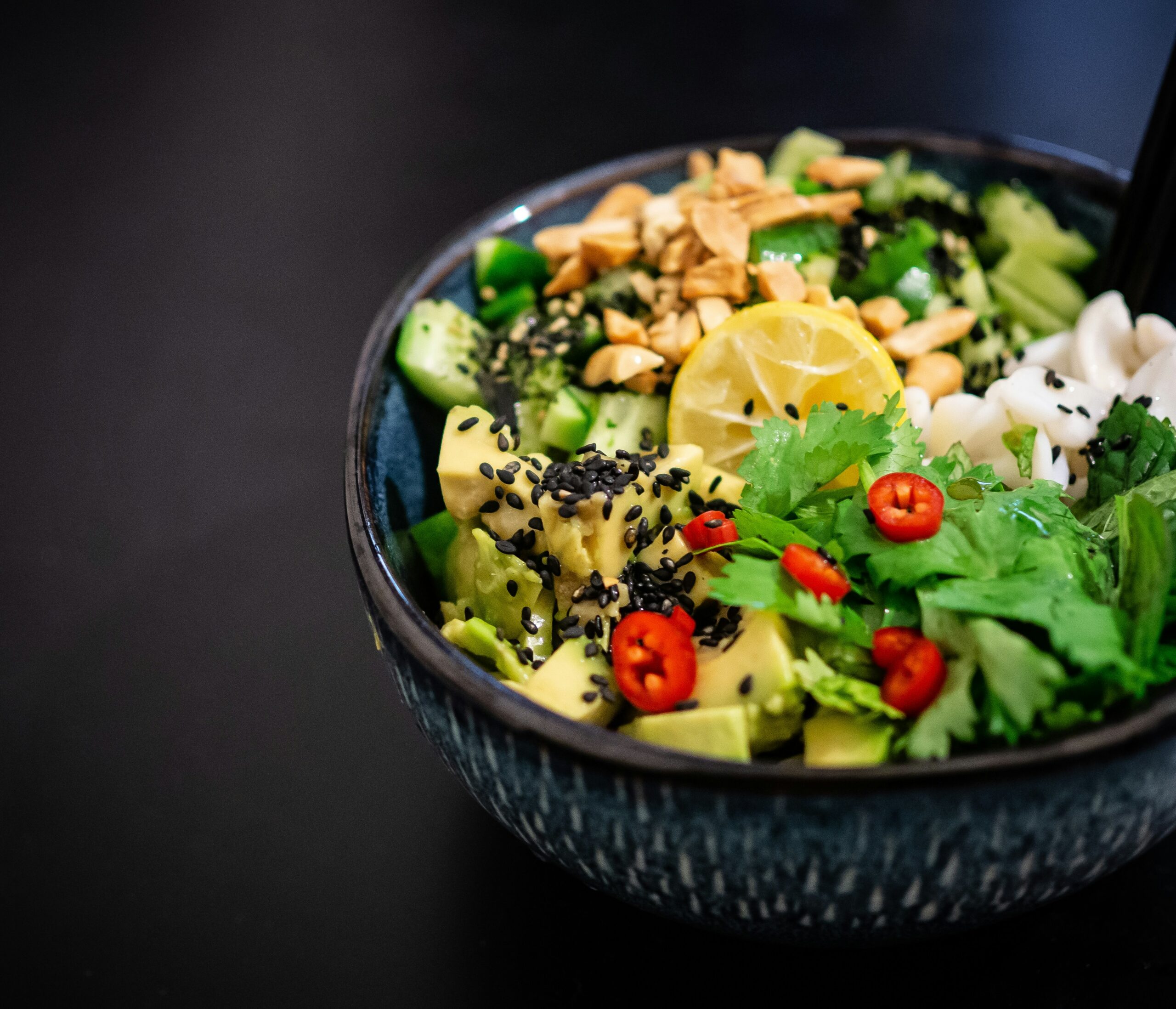 A colorful bowl of anti-inflammatory foods like avocado, greens, and lemon, supporting mood balance in endometriosis management. - Rachael Haverland Site A colorful bowl of anti-inflammatory foods like avocado, greens, and lemon, supporting mood balance in endometriosis management.