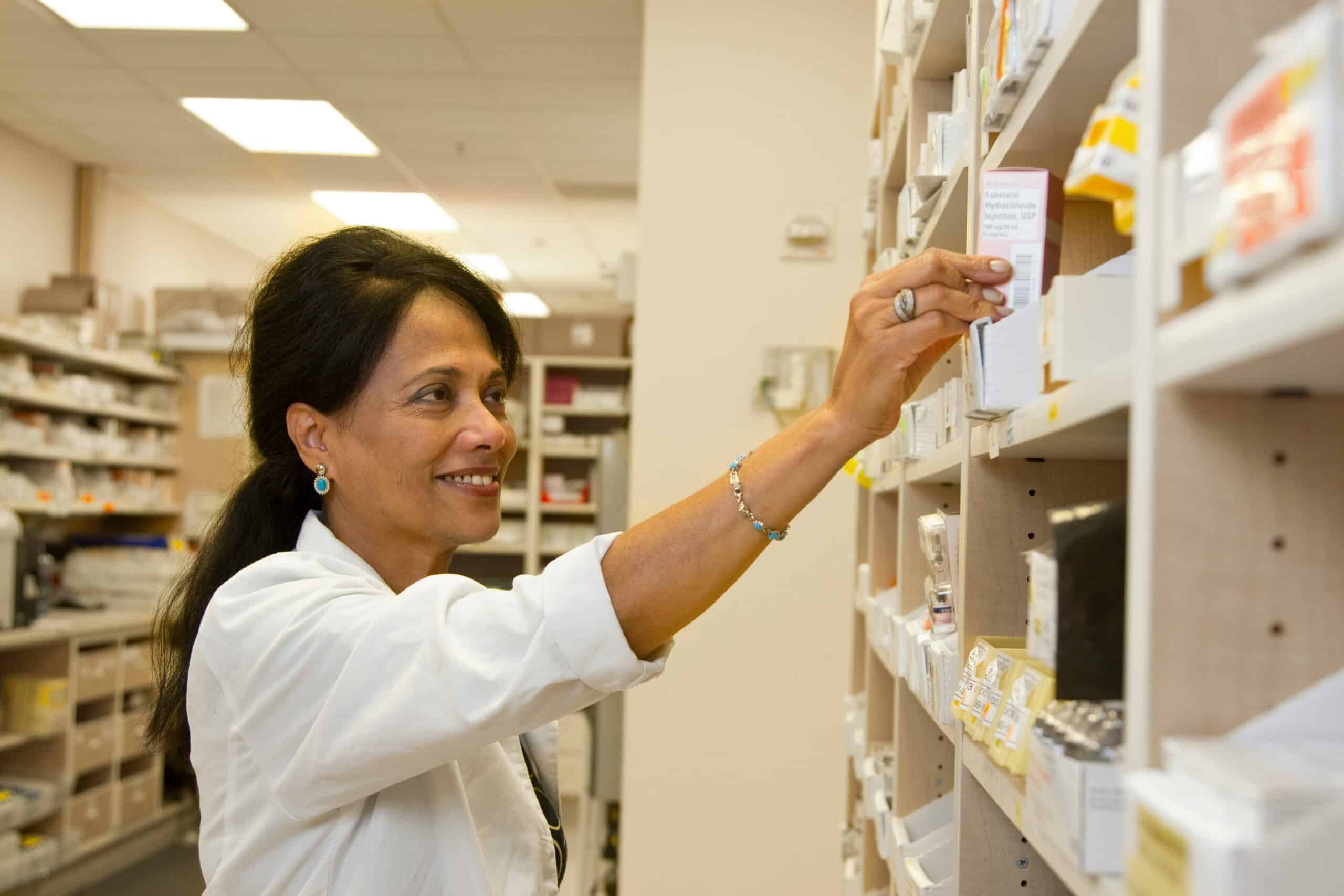 Pharmacist preparing medication used in endometriosis management. - Rachael Haverland Site Pharmacist preparing medication used in endometriosis management.