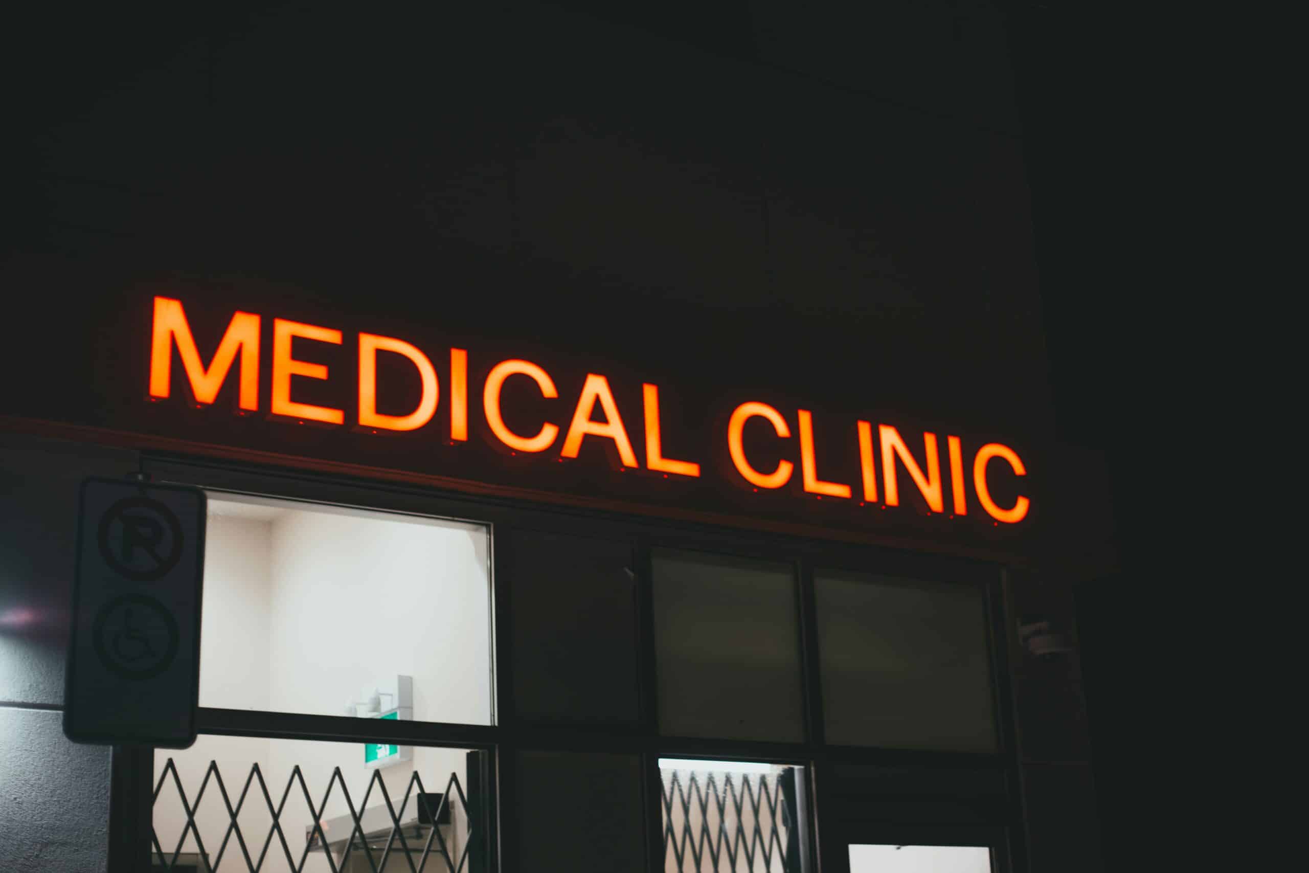 A glowing red "Medical Clinic" sign above an entrance, symbolizing access to treatment options and their potential impact on fertility outcomes. - Rachael Haverland Site A glowing red "Medical Clinic" sign above an entrance, symbolizing access to treatment options and their potential impact on fertility outcomes.