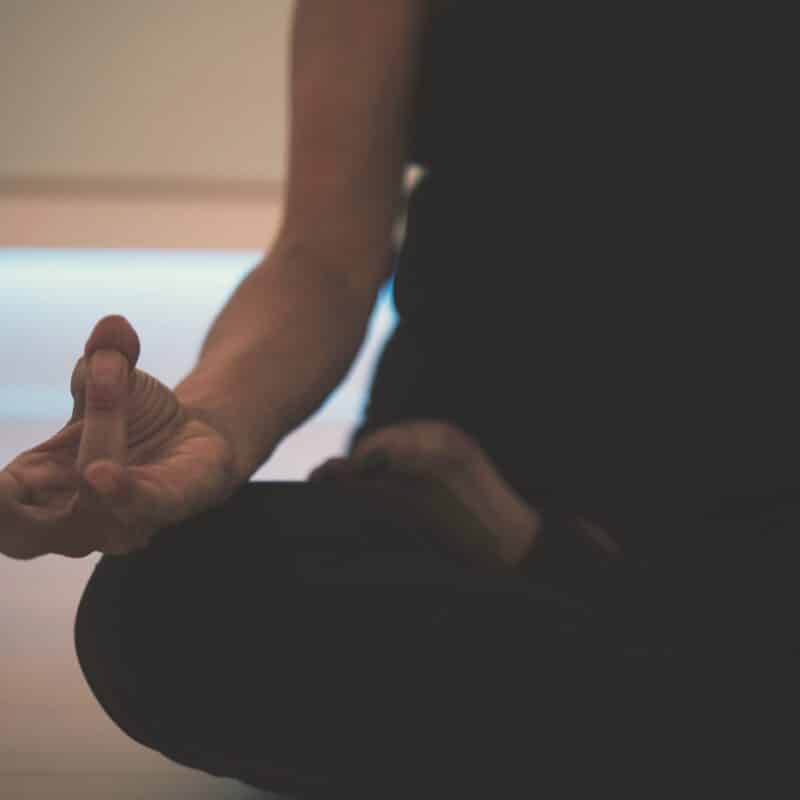 woman sitting in a yoga pose