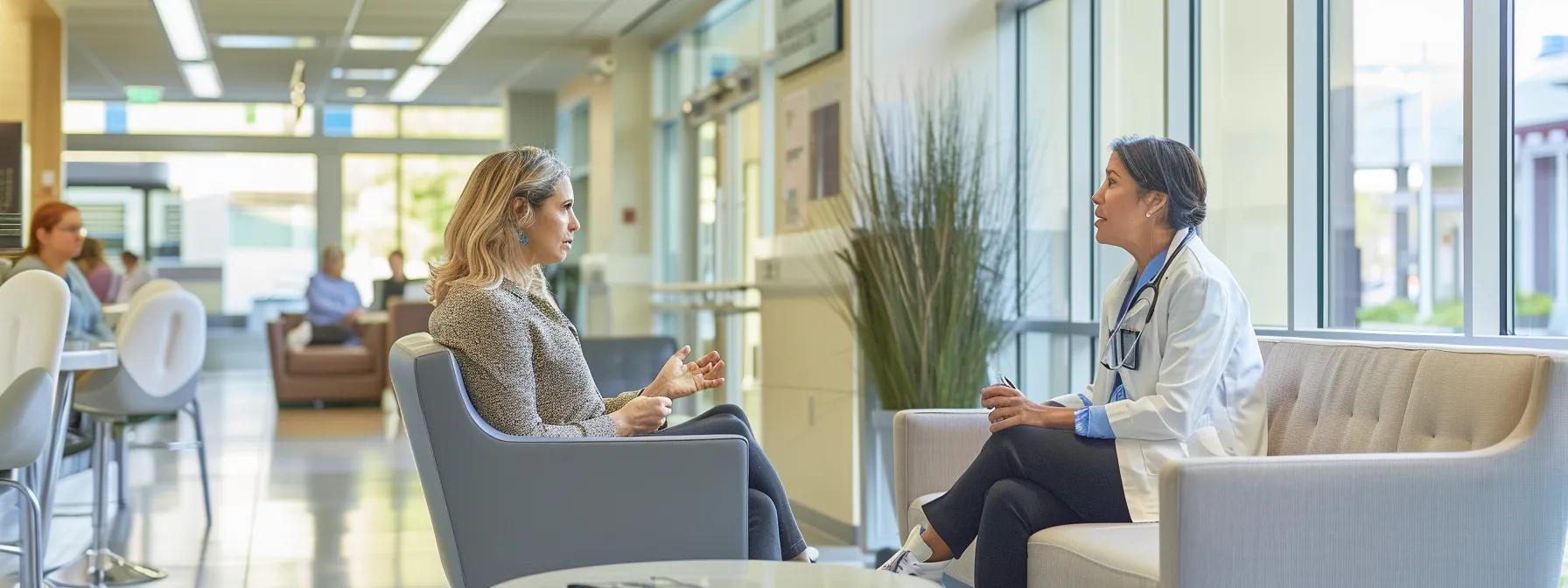 a modern healthcare clinic interior features a woman discussing hormone therapy for endometriosis with a medical professional - Rachael Haverland Site a modern healthcare clinic interior features a woman discussing hormone therapy for endometriosis with a medical professional