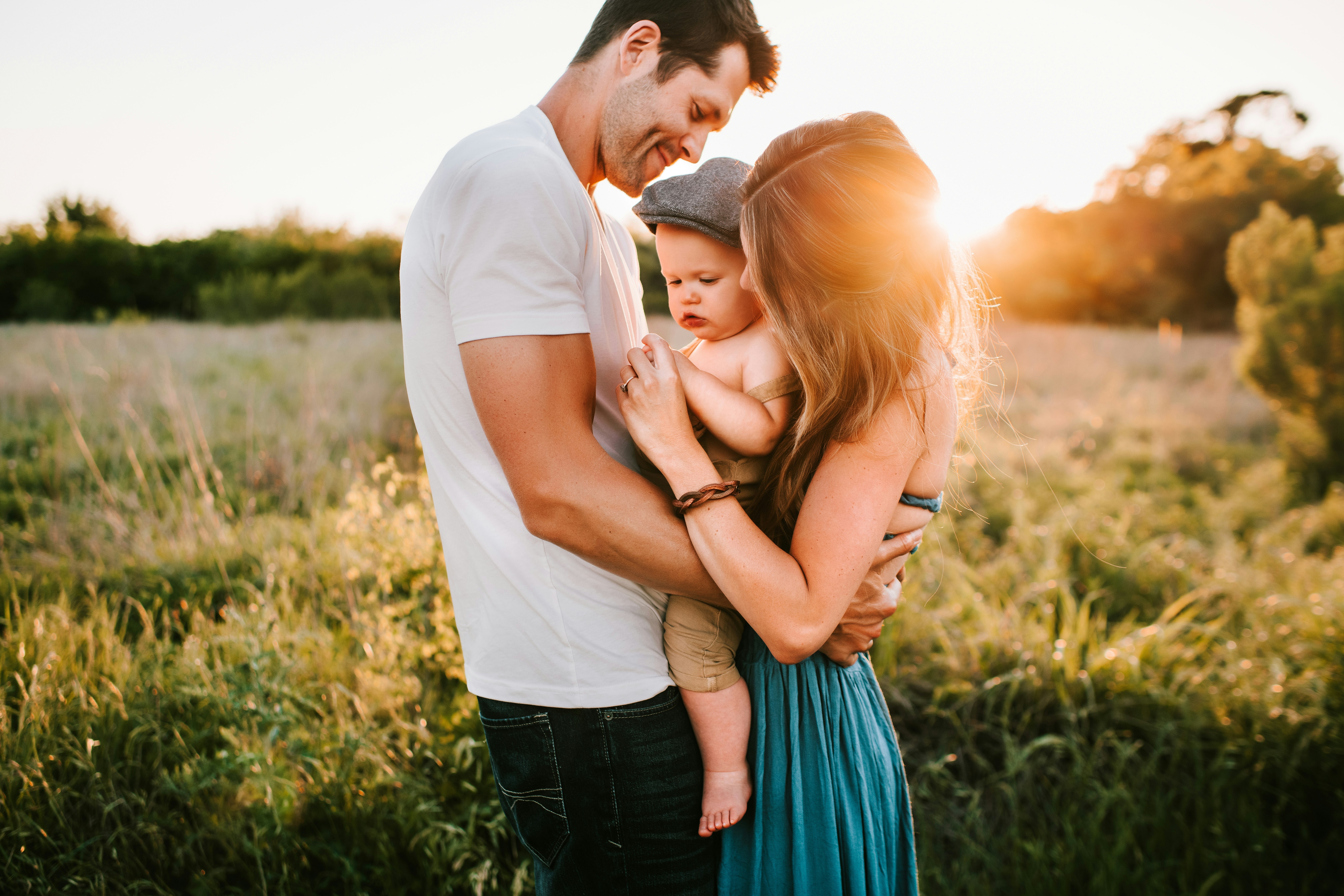 a couple holding their baby - Rachael Haverland Site a couple holding their baby