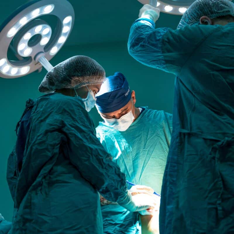 surgeons performing a surgery in an operation theatre