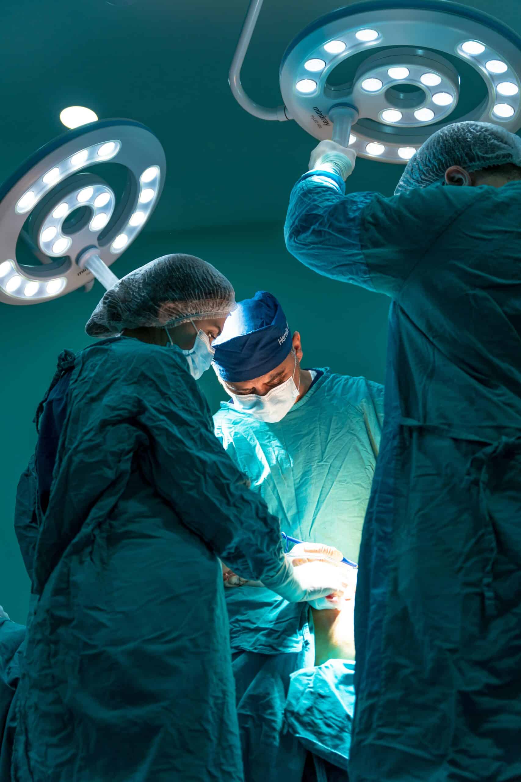A surgical team performs a procedure under bright lights, illustrating one of the medical treatment options for managing endometriosis symptoms during menstruation. - Rachael Haverland Site A surgical team performs a procedure under bright lights, illustrating one of the medical treatment options for managing endometriosis symptoms during menstruation.
