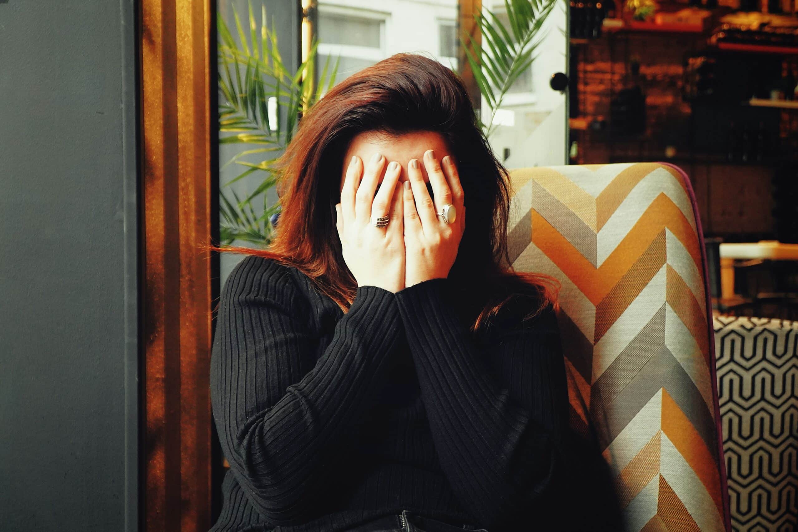 a woman with her face covered with her hands - Rachael Haverland Site a woman with her face covered with her hands
