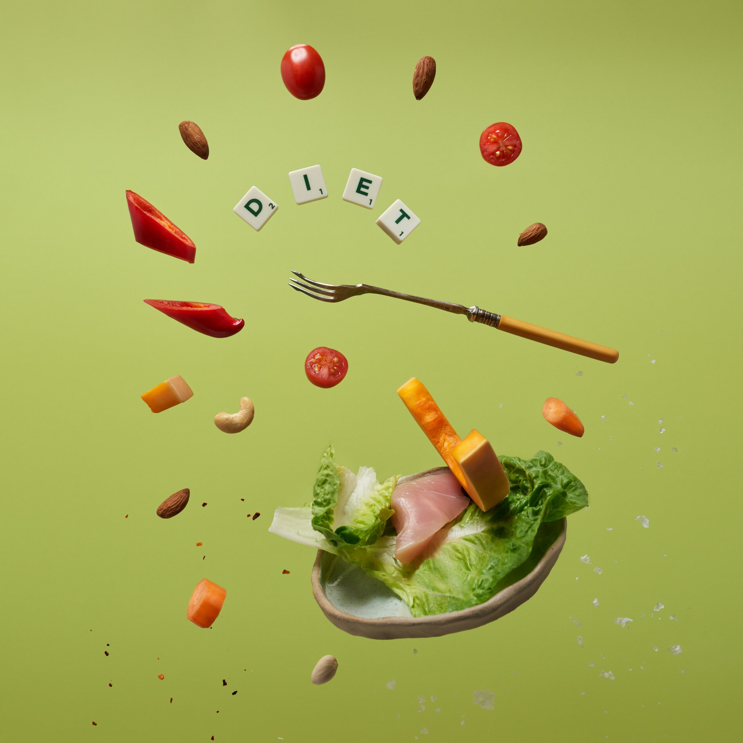 Colorful healthy foods and a fork suspended mid-air suggest how diet and lifestyle changes can support omega-3 benefits in endometriosis care. - Rachael Haverland Site Colorful healthy foods and a fork suspended mid-air suggest how diet and lifestyle changes can support omega-3 benefits in endometriosis care.