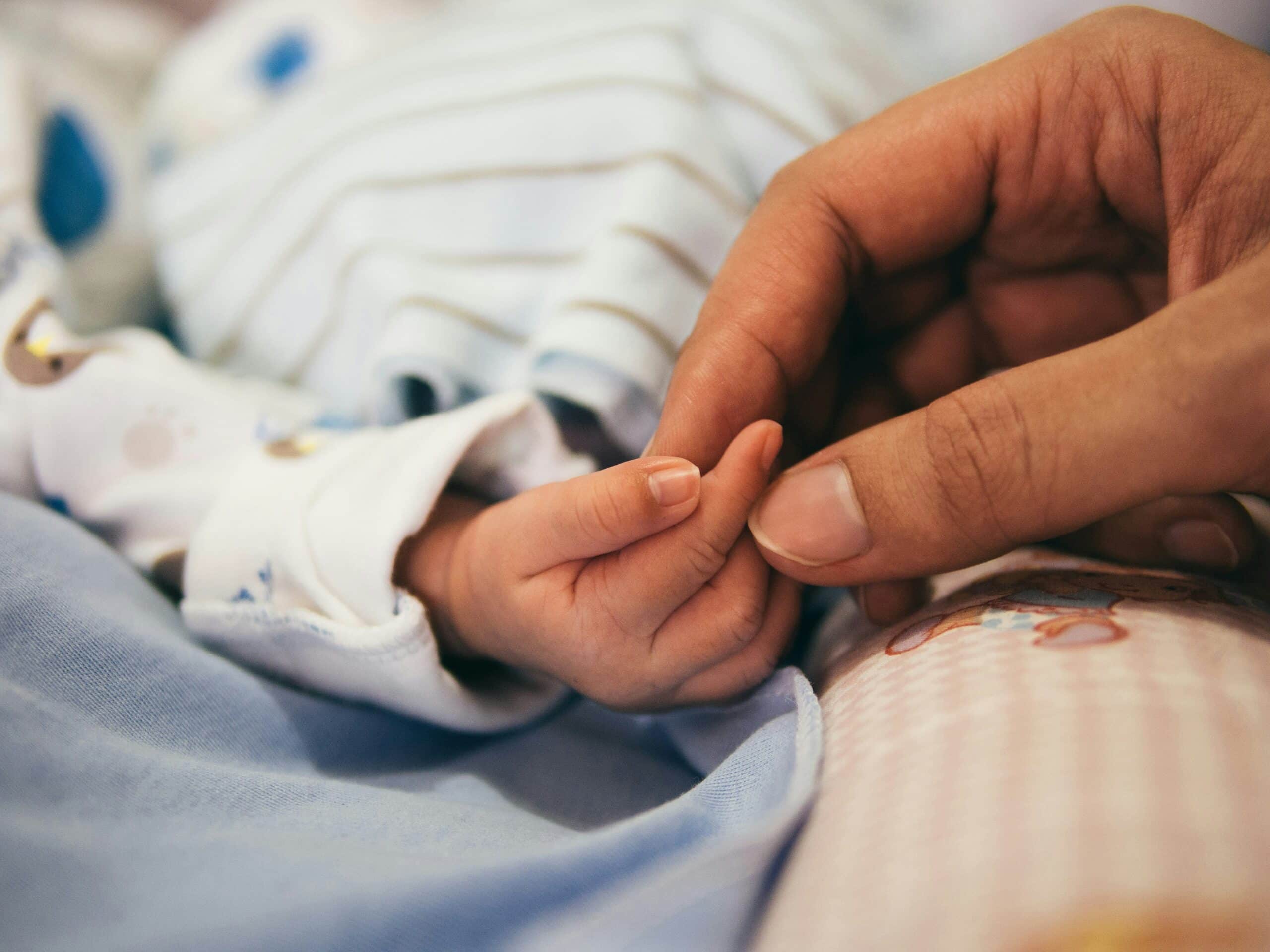 a person holding a baby's hand - Rachael Haverland Site a person holding a baby's hand