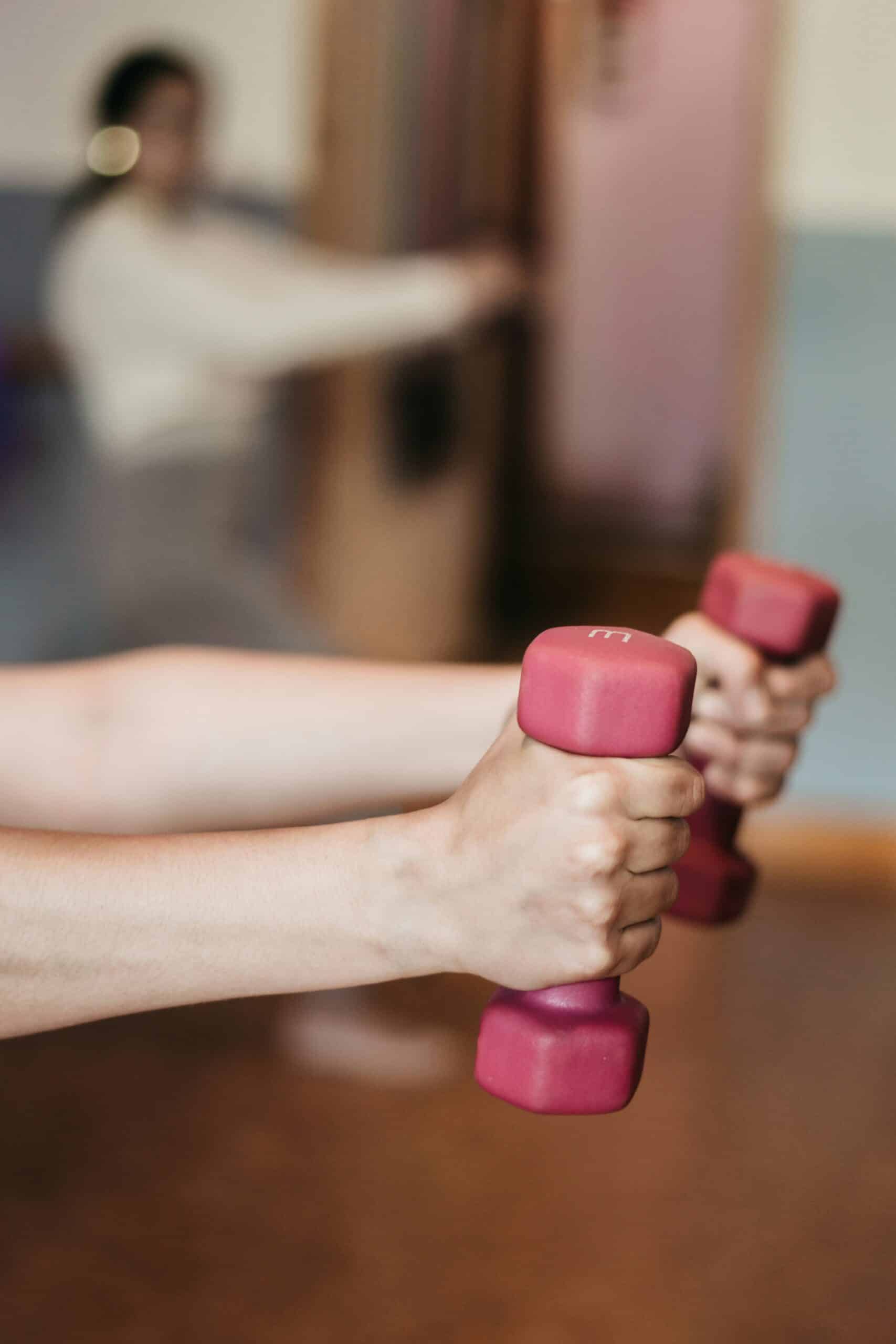 a woman holding weights