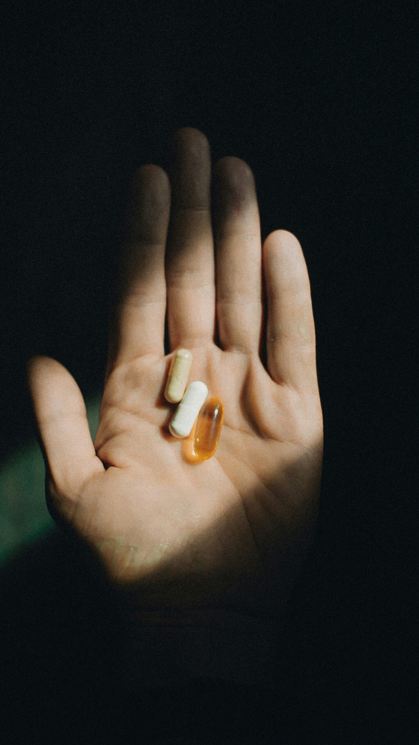 pills in a woman's hand