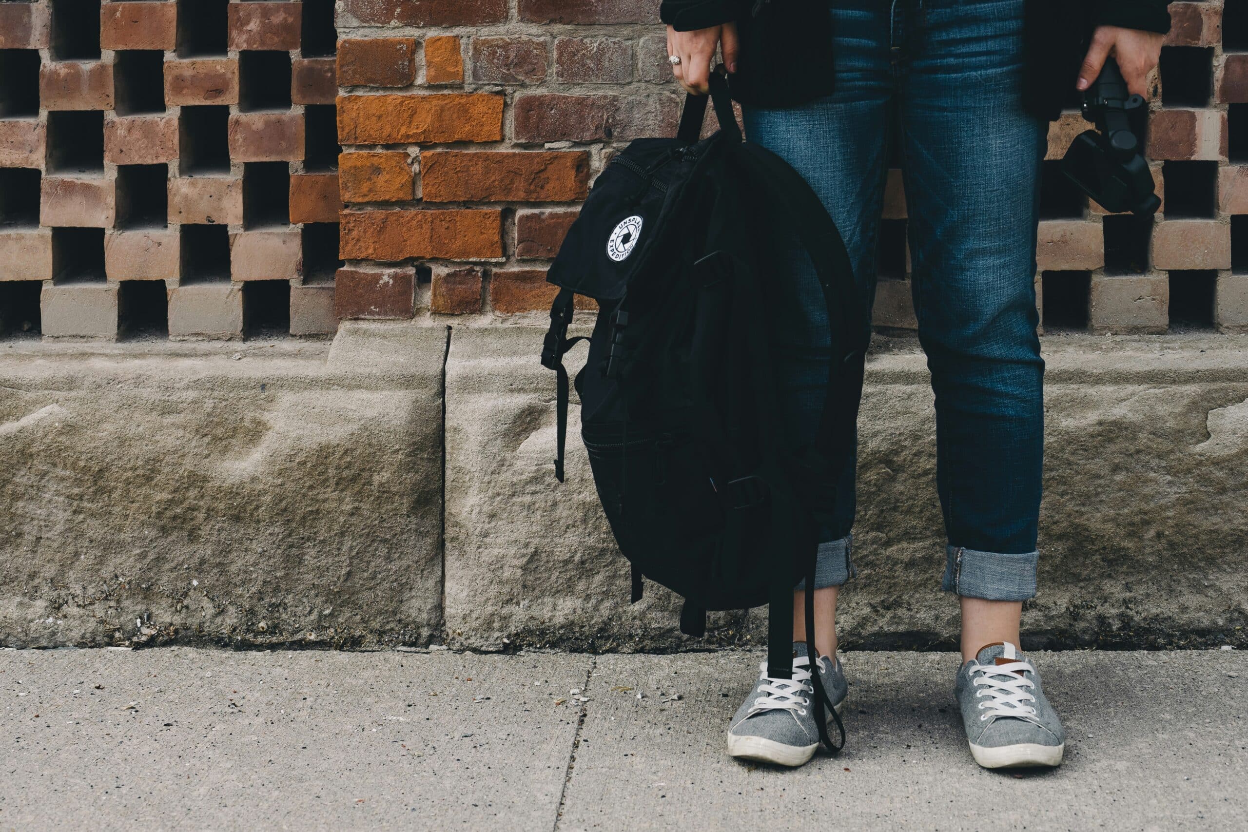 teen holding school bag