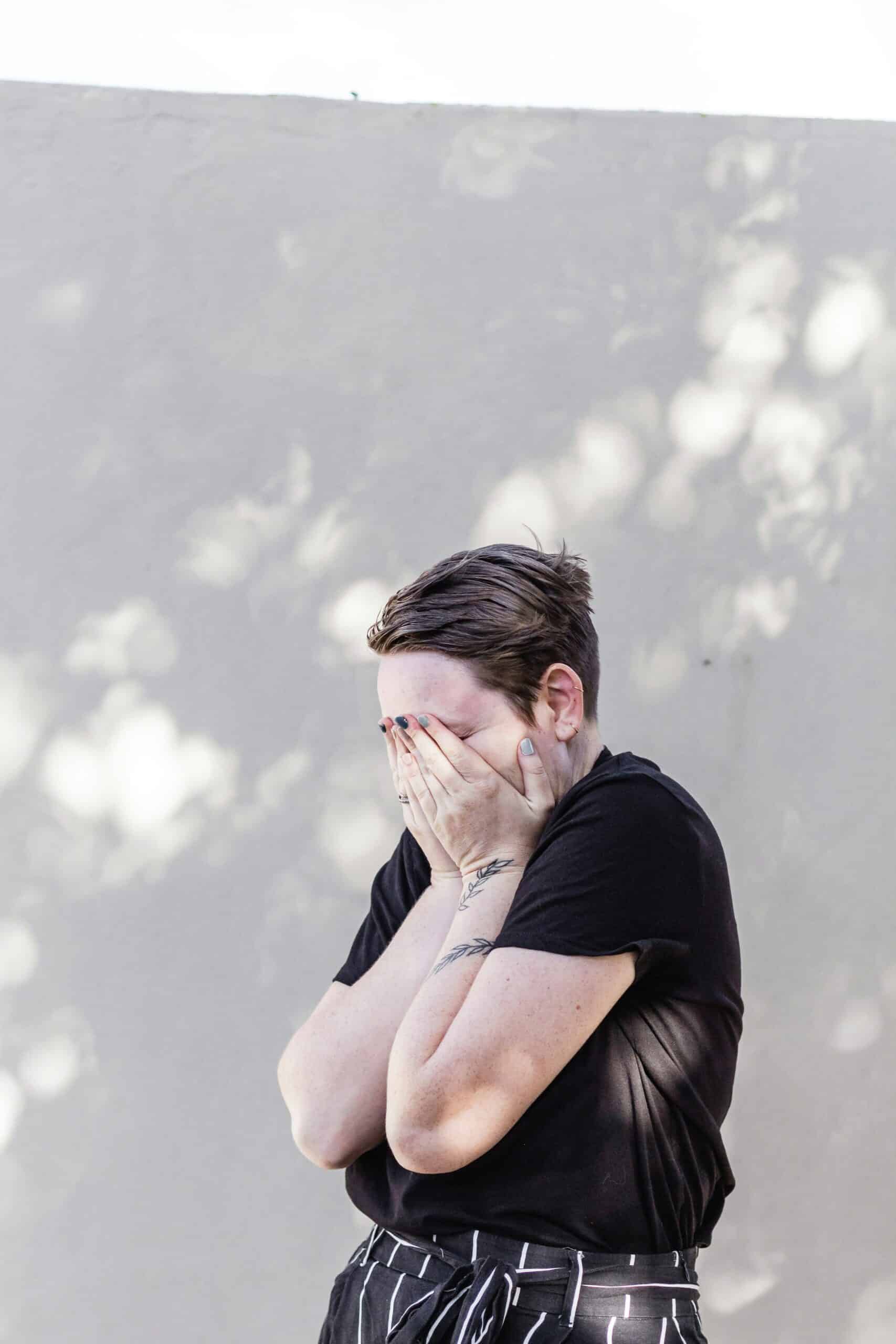 a woman covering her face with her hands - Rachael Haverland Site a woman covering her face with her hands