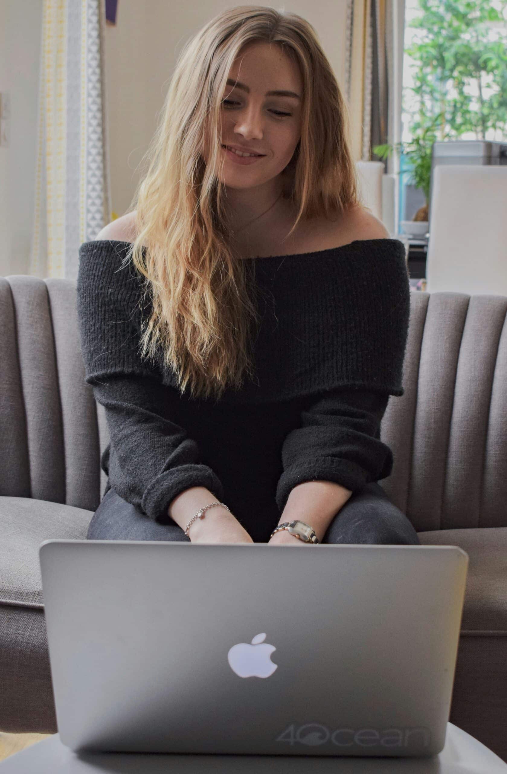 a woman researching with her laptop
