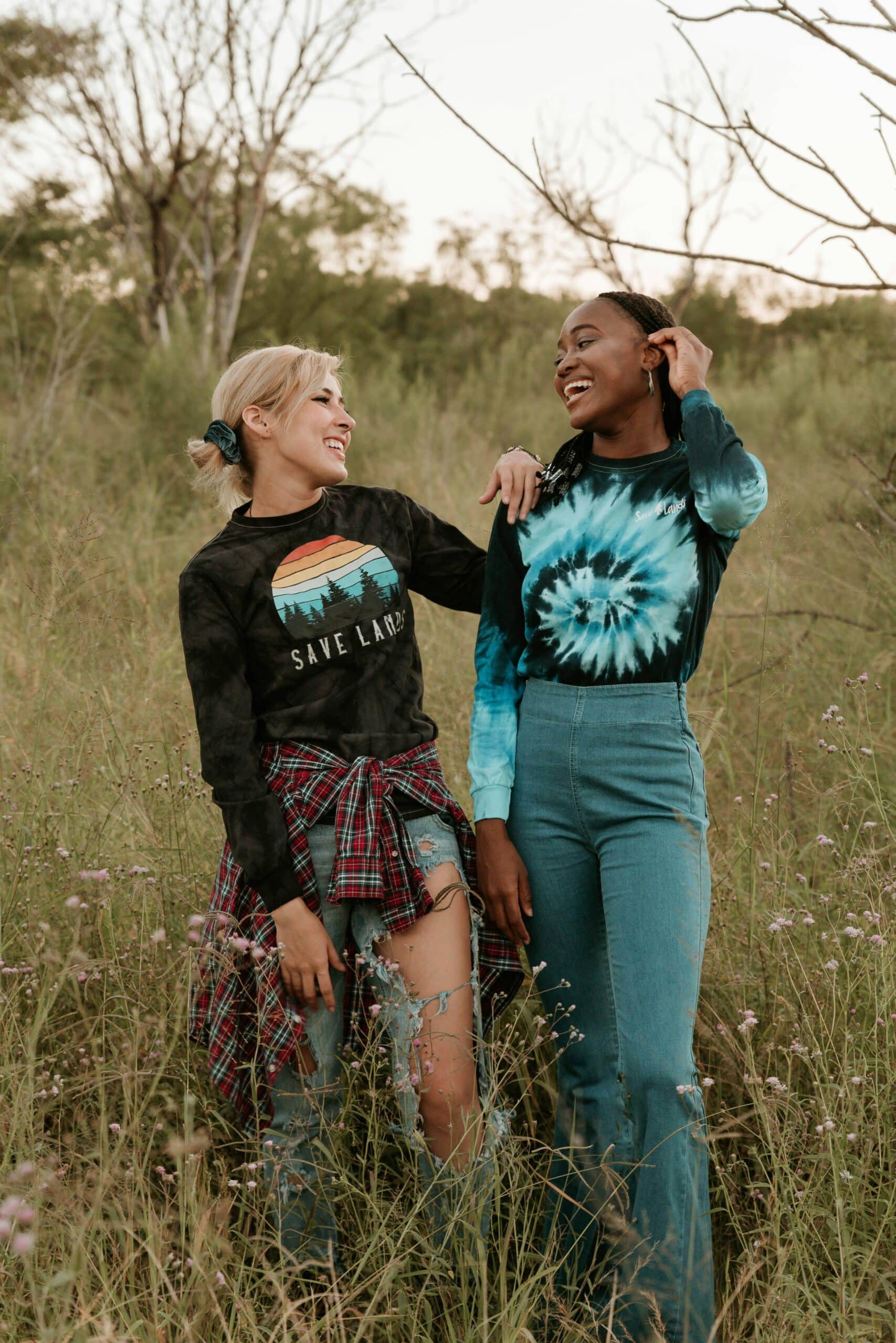two teenage girls smiling at eachother