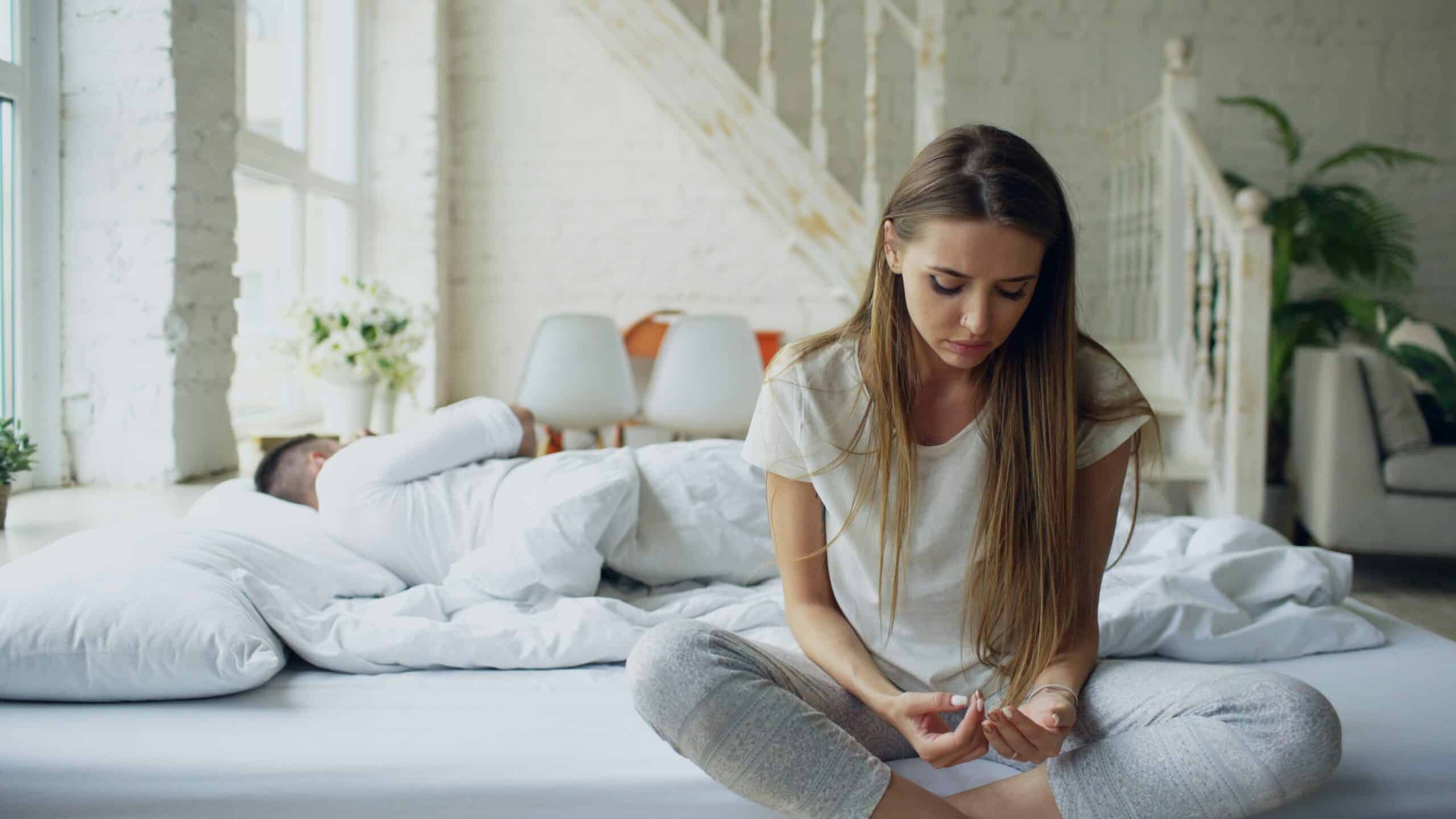 a woman sitting on the bed