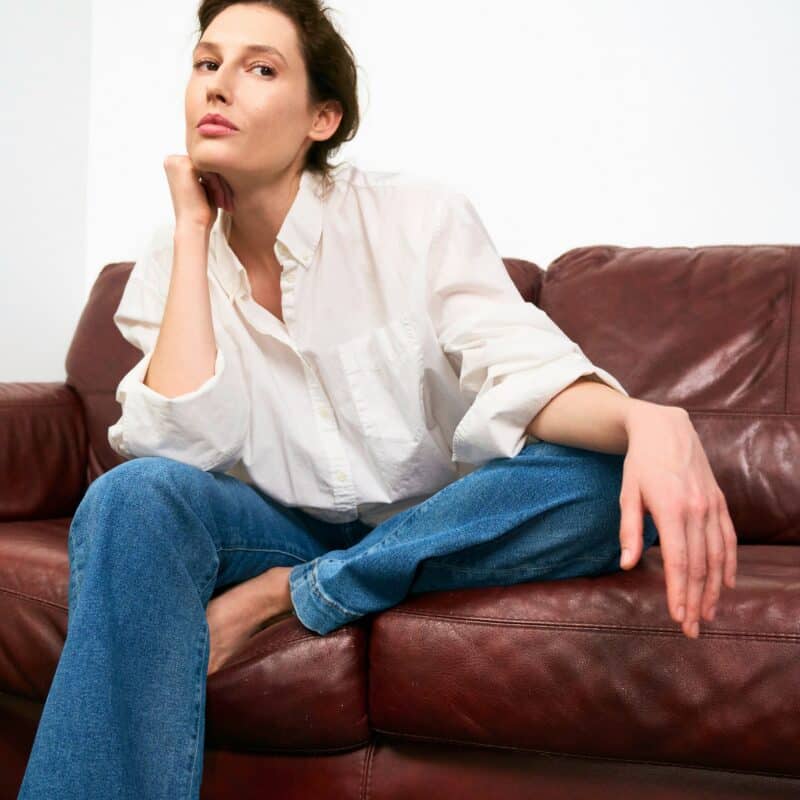 a woman sitting on the couch