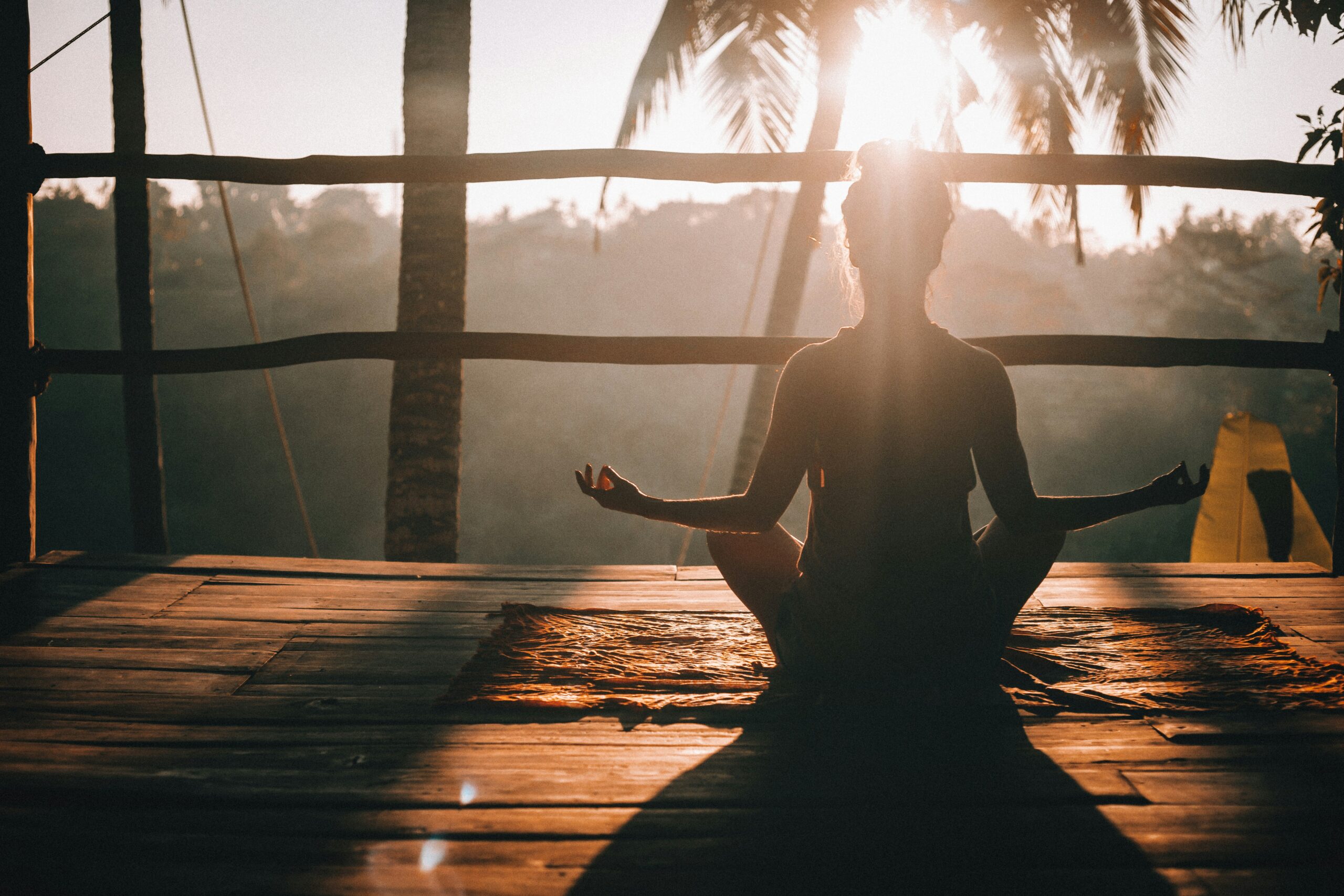 Woman practicing yoga, illustrating the role of physical therapy in pre- and post-treatment care for endometriosis.