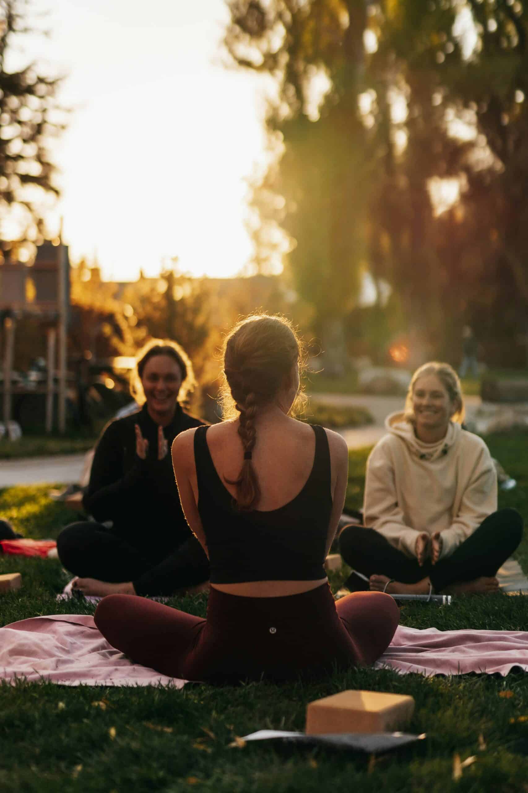 Group of women practicing yoga together, illustrating how physical therapy helps provide relief for people with endometriosis.