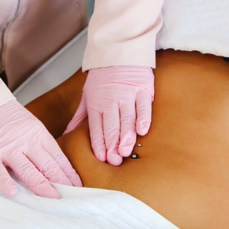 massage therapy on a woman's pelvic