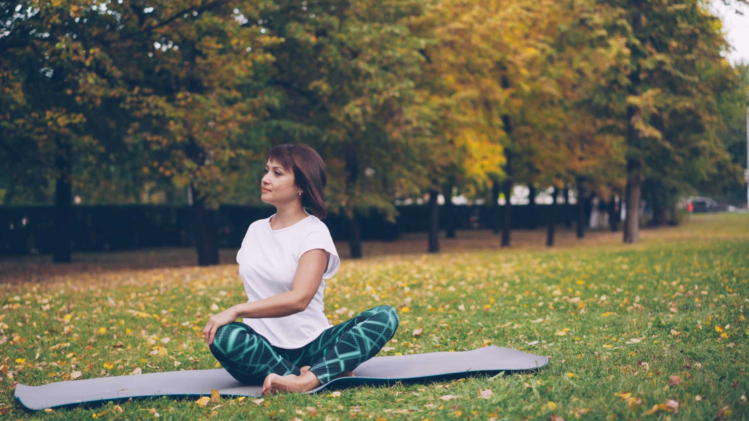 Woman performing a yoga pose, illustrating the benefits of integrating physical therapy with endometriosis excision surgery for improved recovery and symptom relief.