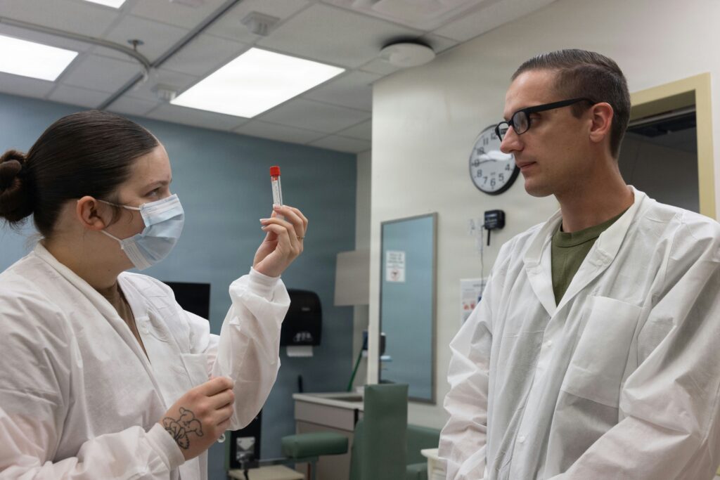 Clinicians examining a medical sample