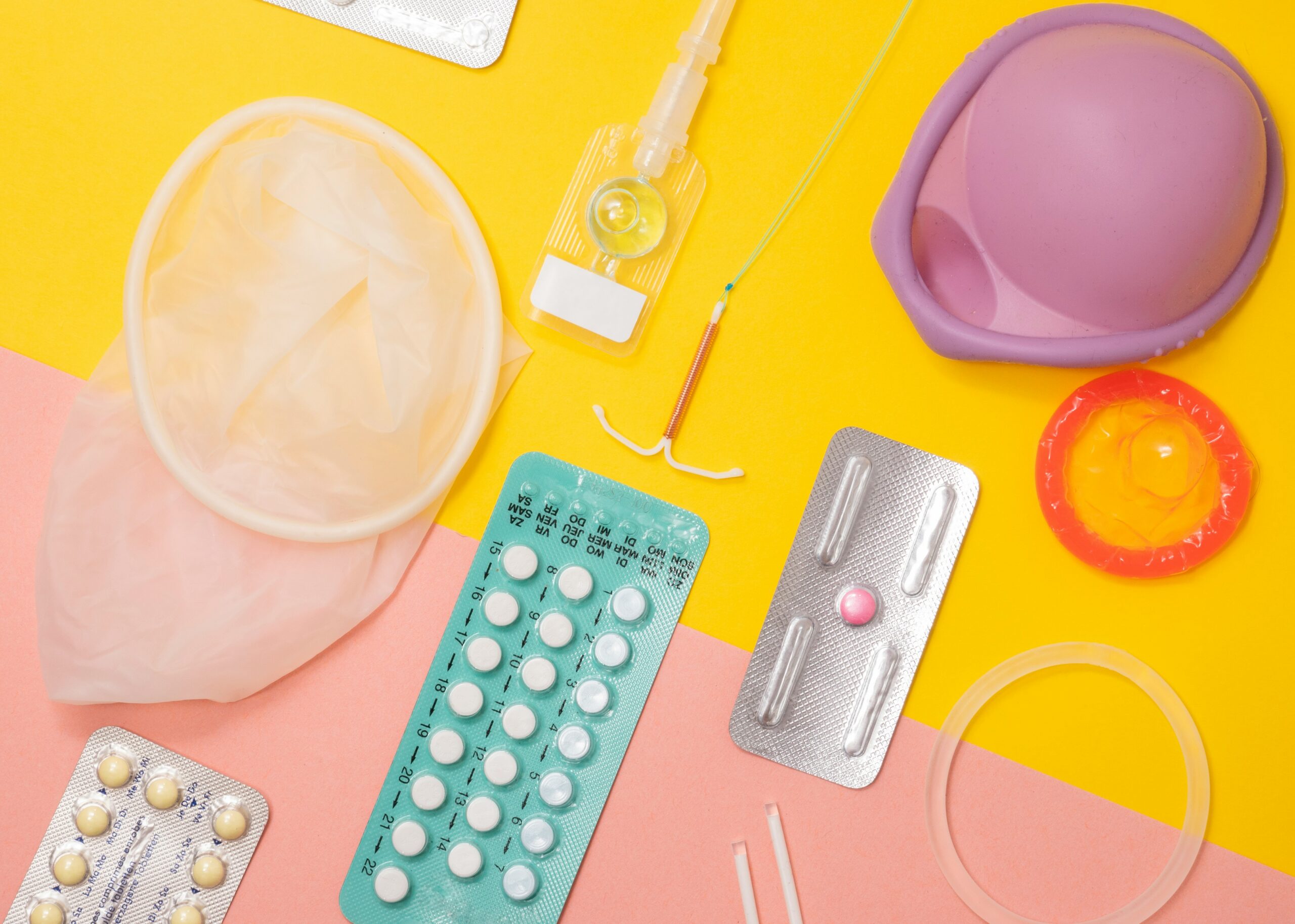 Fertility and contraception supplies on a bright background