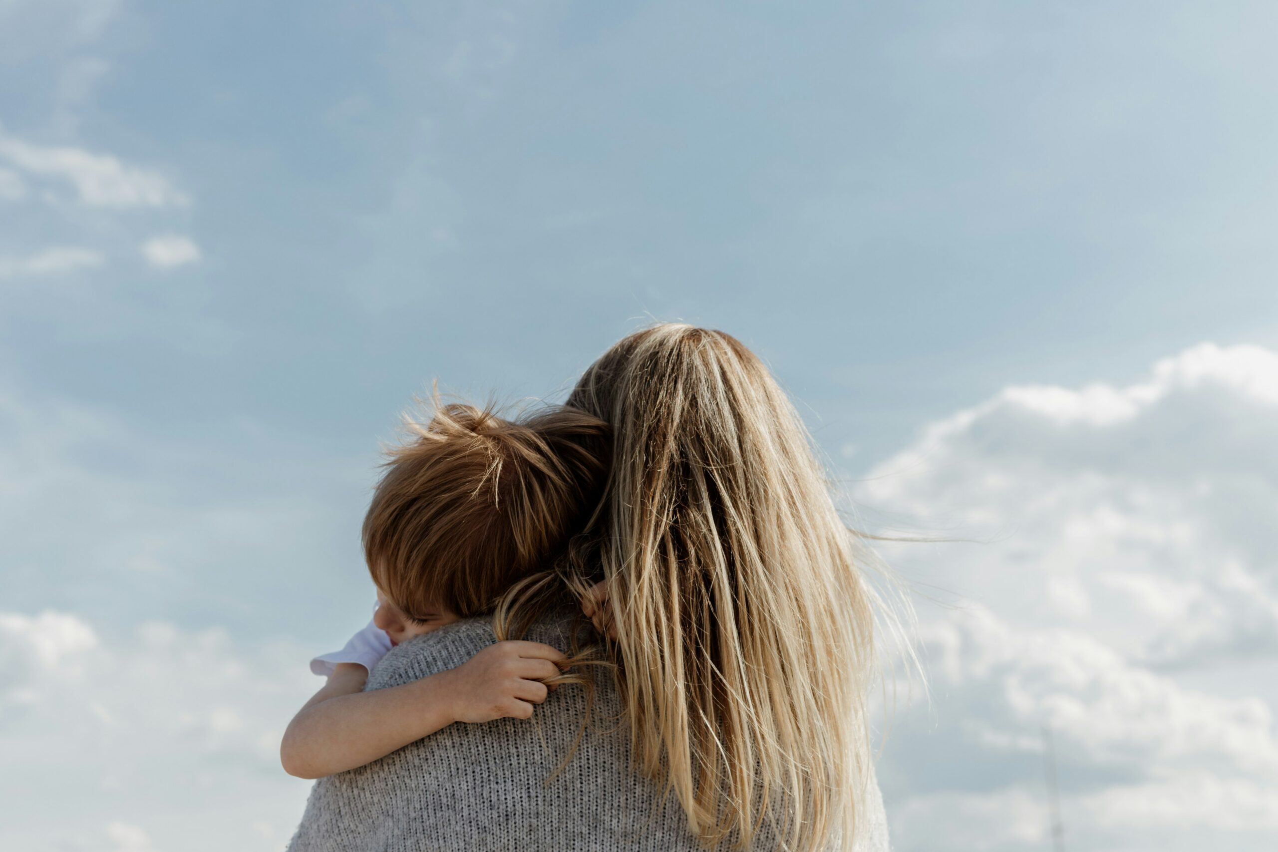 a woman holding her child - Rachael Haverland Site a woman holding her child