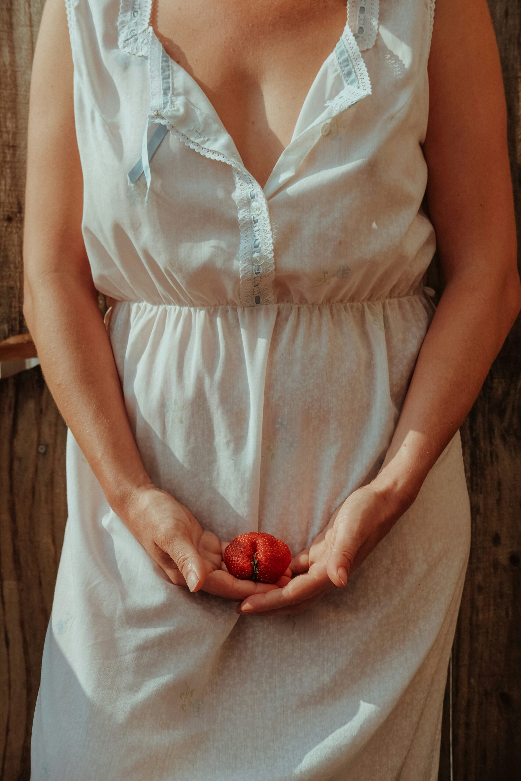 A woman holding strawberry