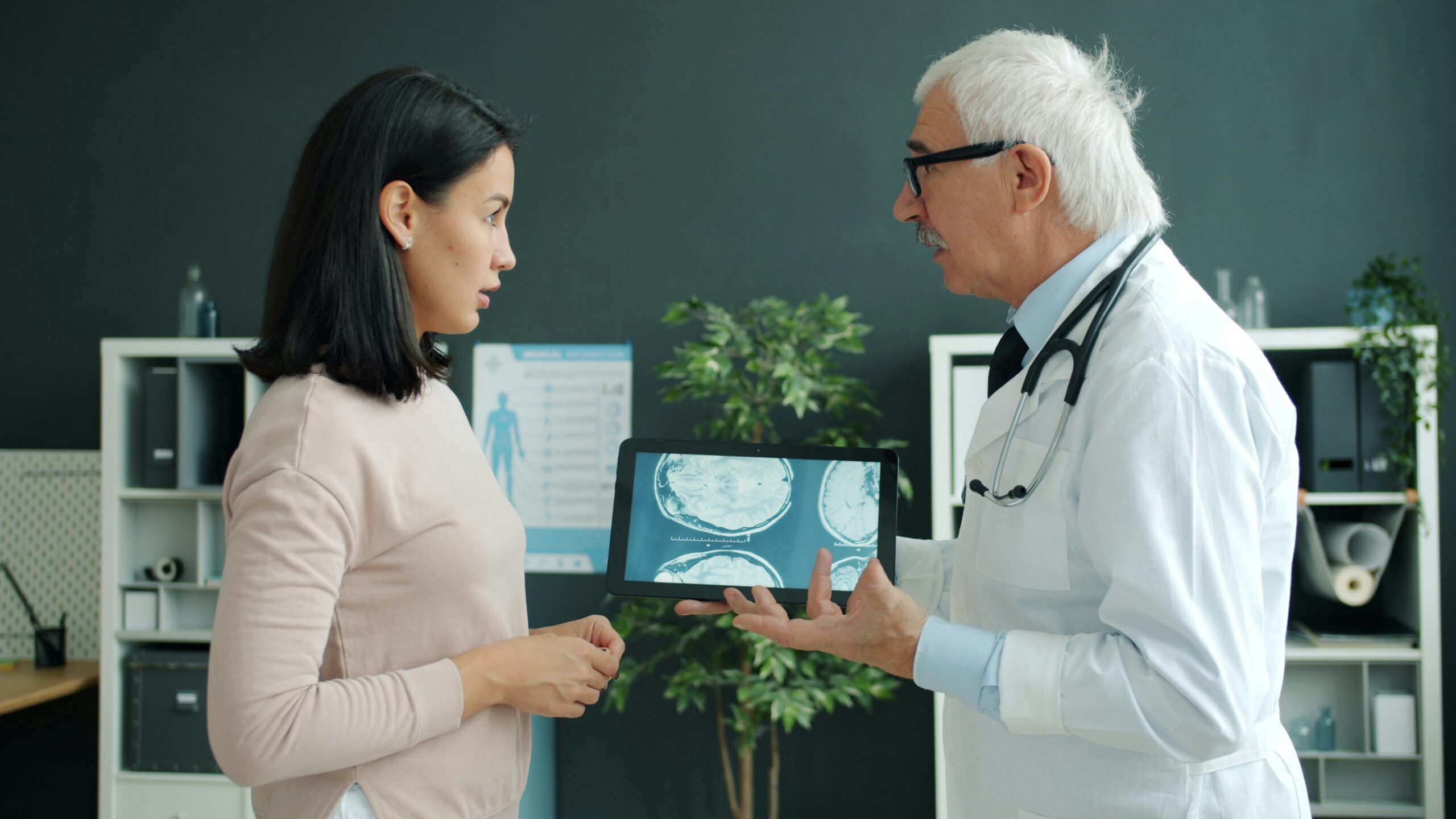 doctor shows patient medical scan