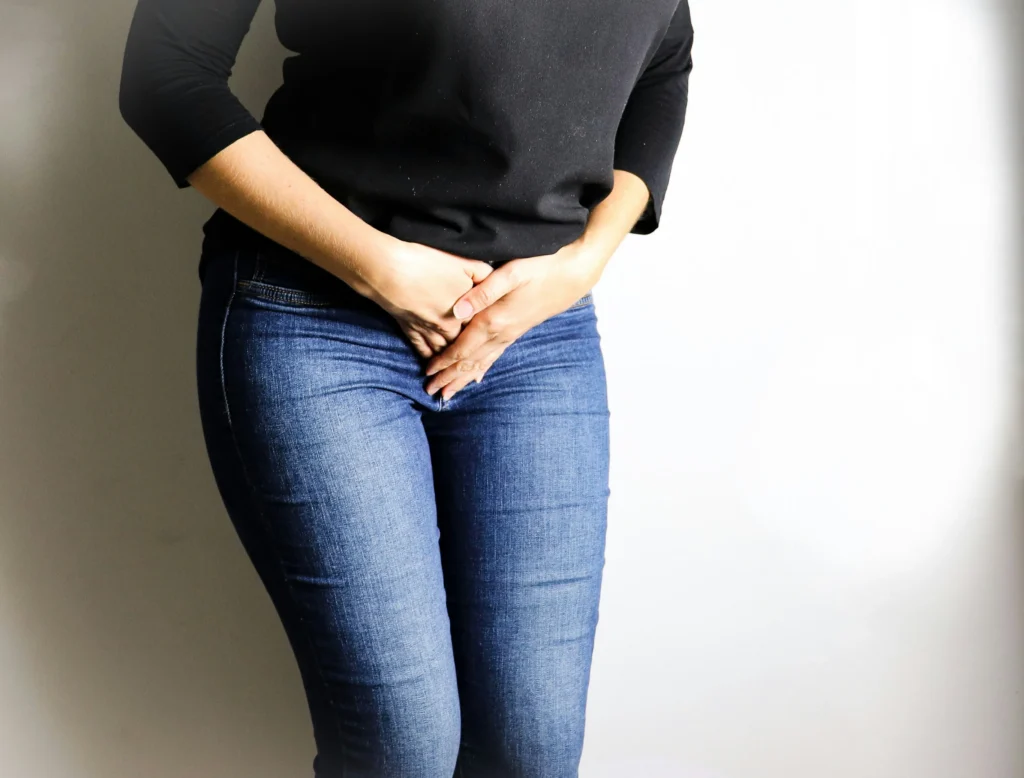 Woman experiencing painful bowel movements during menstruation