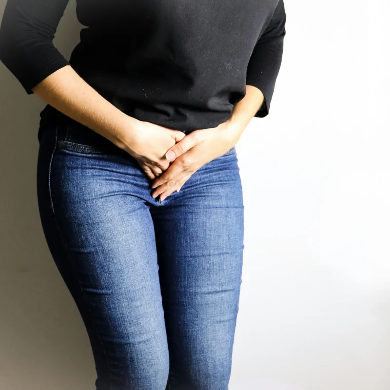 Woman experiencing painful bowel movements during menstruation