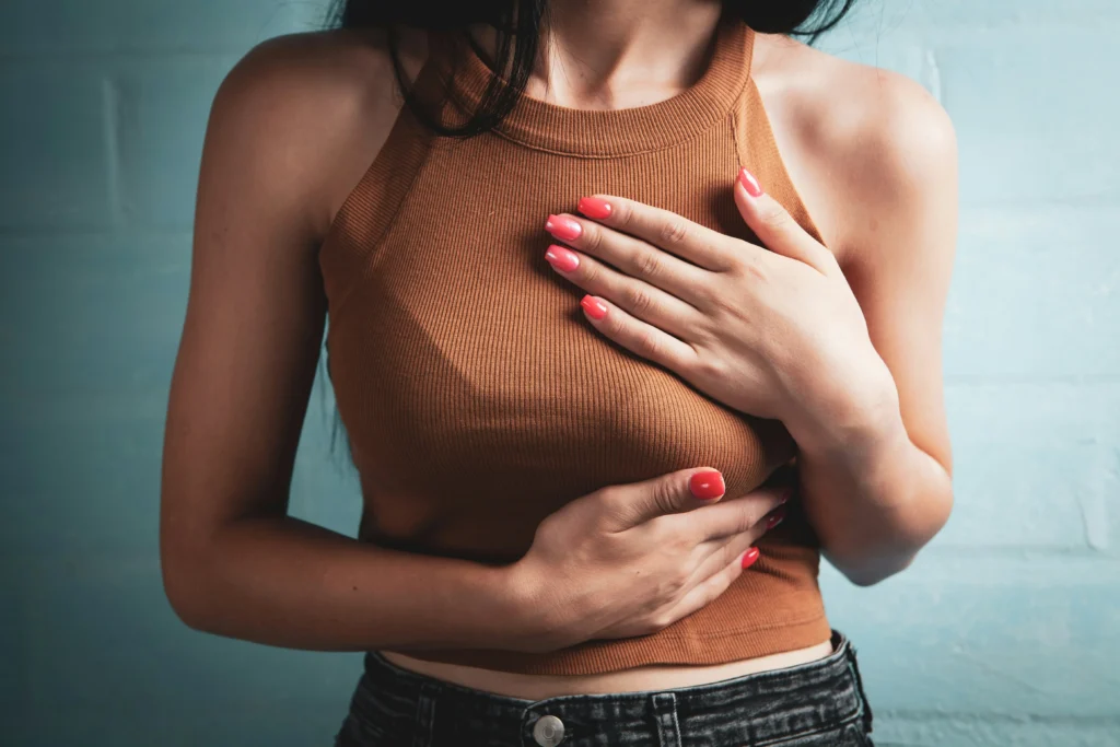 Woman experiencing chest pain during menstruation caused by thoracic endometriosis