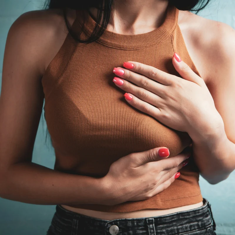 Woman experiencing chest pain during menstruation caused by thoracic endometriosis