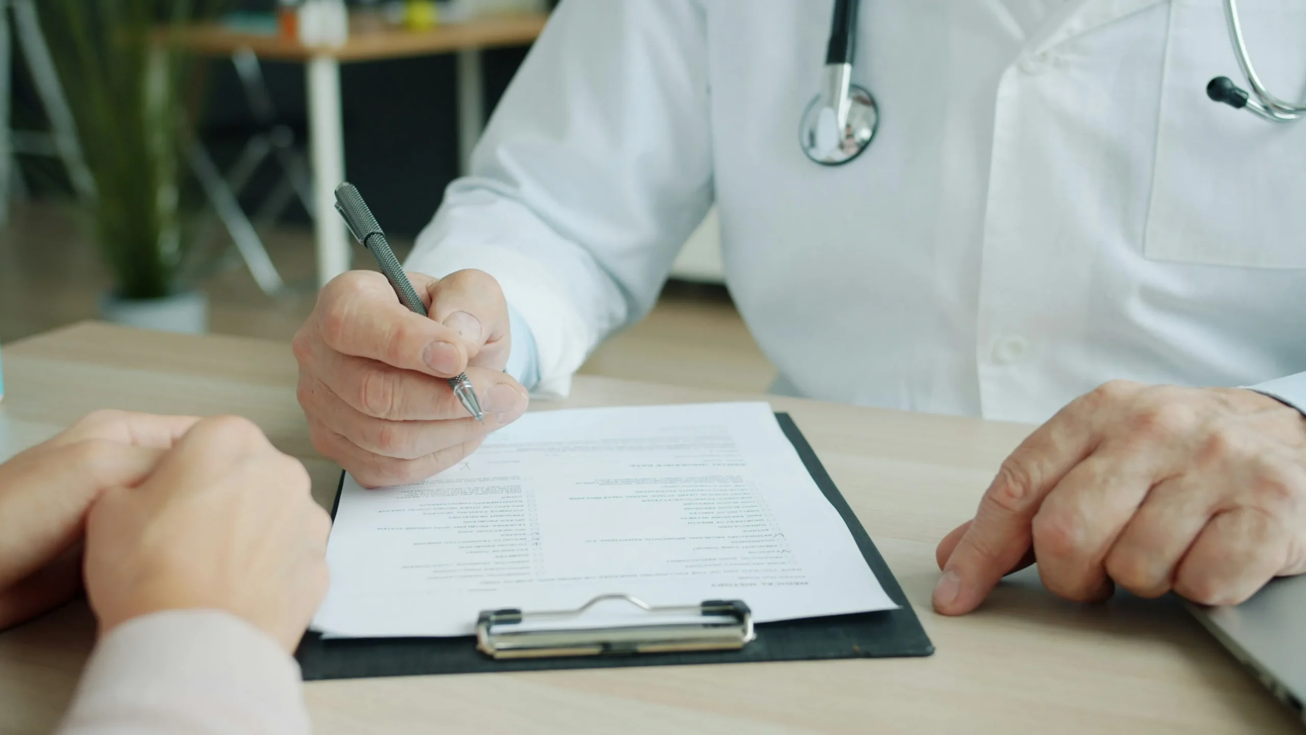 healthcare professional taking history of a patient