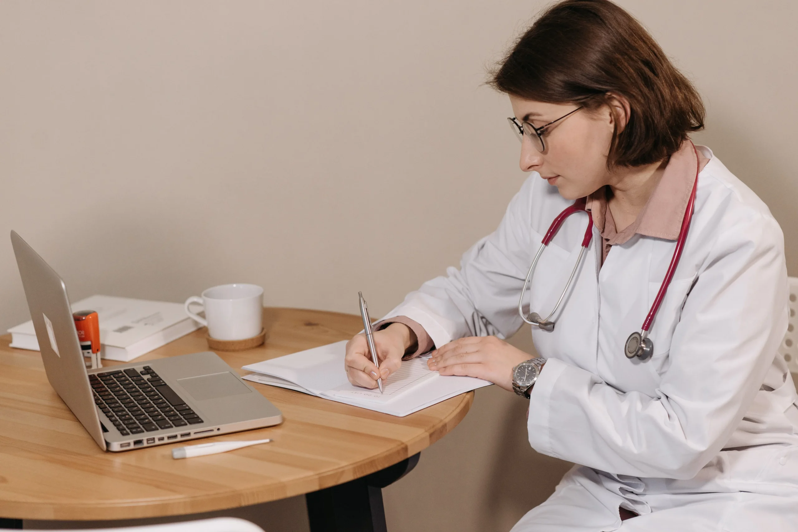 24aadf85 3597 47a5 af7b d5520b8410fcwebp - Rachael Haverland Site A doctor writing a prescription