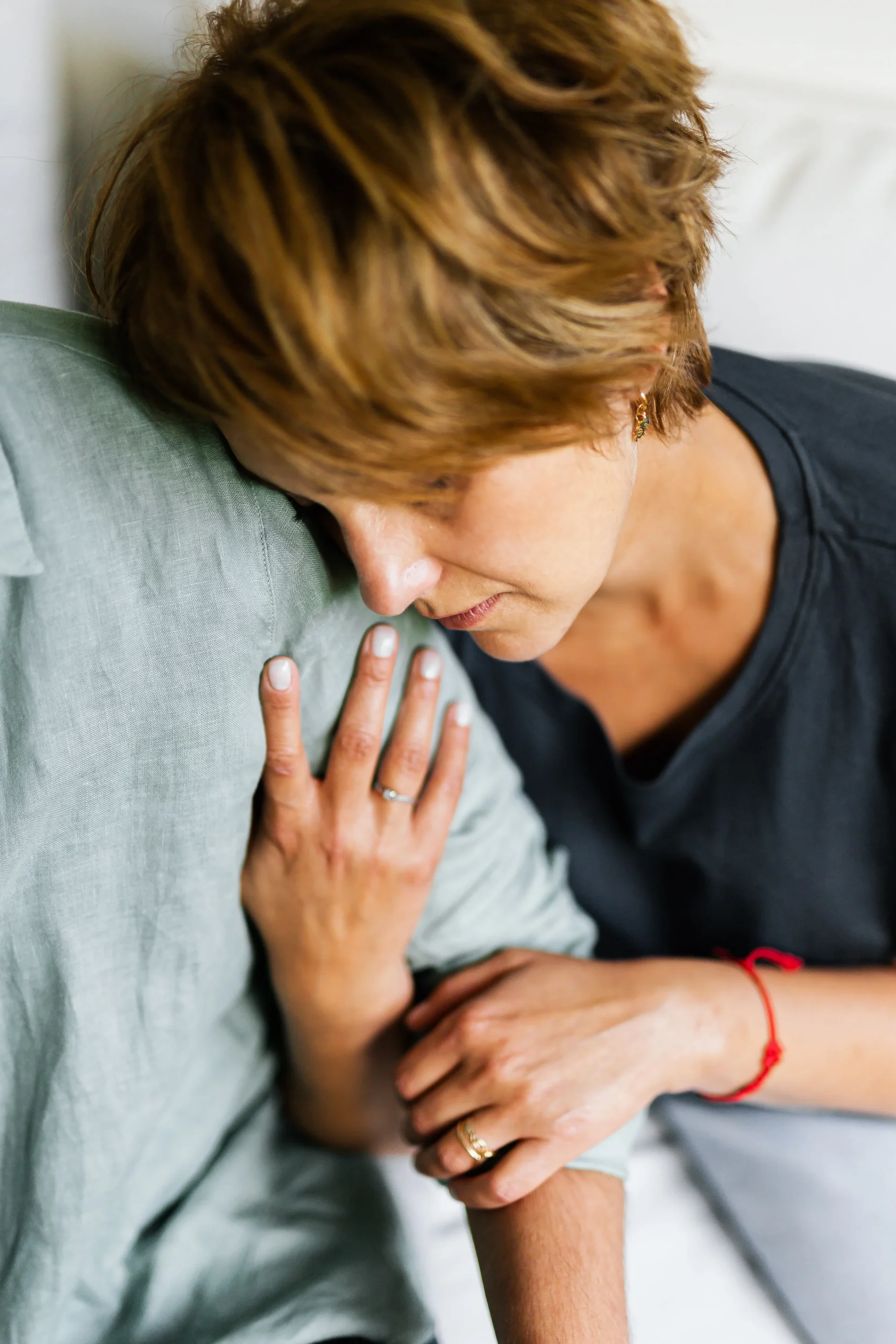 A woman holding onto a shoulder