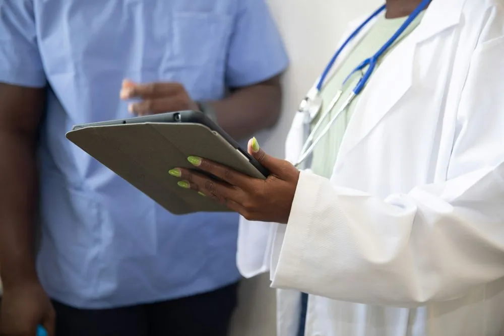 doctor reading records of patient