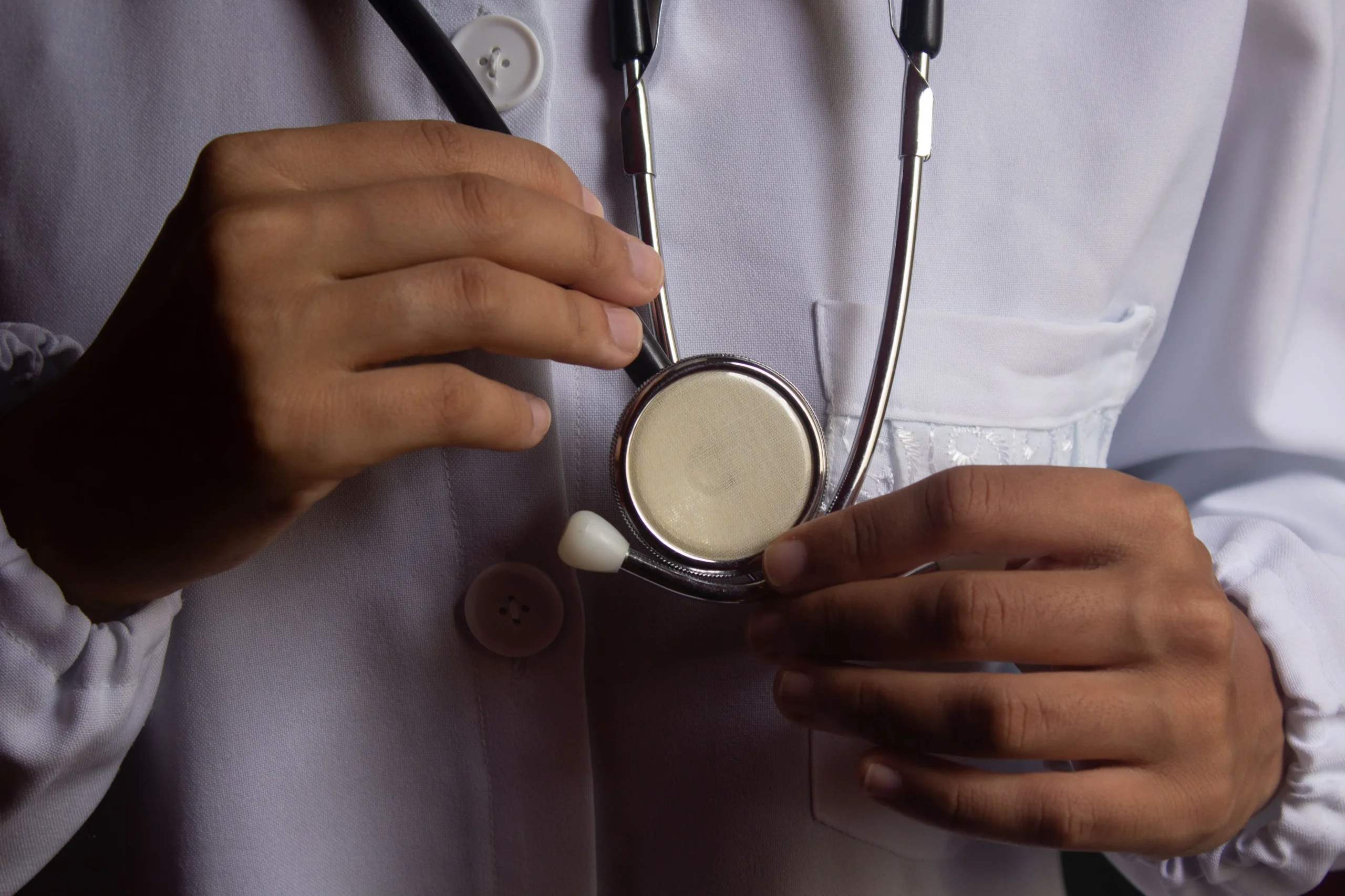 A surgeon wearing a stethoscope