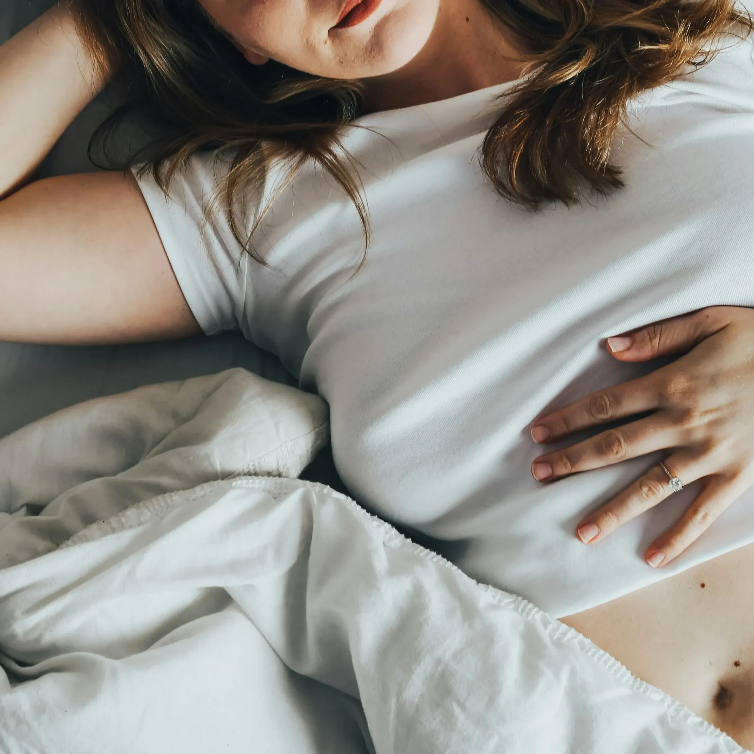 Woman experiencing pelvic pain associated with endometriosis